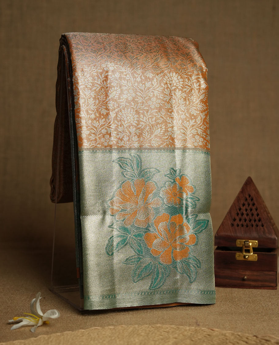 Mustrad orange colour and Antique gold Zari Tissue Brocade Saree features intricate floral Motifs on body and pastel green colour fancy border & pallu with floral patterns, paired with matching blouse