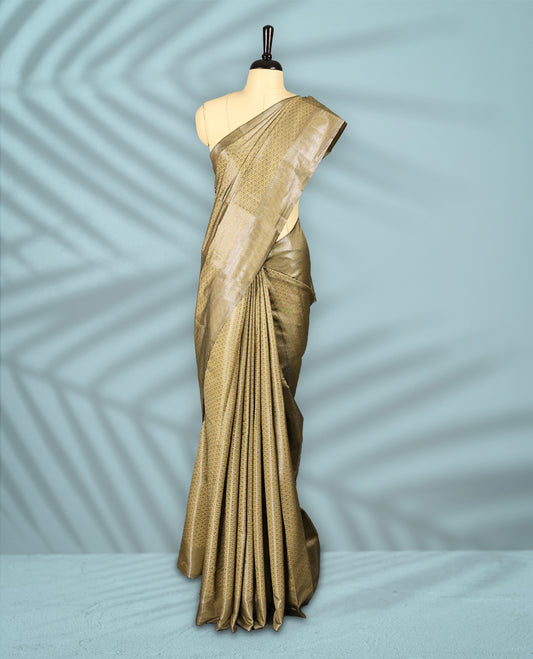 Pastel Gold Colour semi silk saree featuring an intricate Zari  motif weave across the body, paired with a zari worked border with matching blouse.