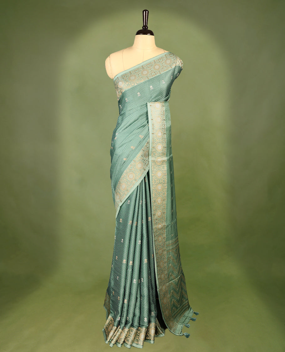 Pastel Green colour pure Banaras crepe saree showcases elegant silver zari Flower Motifs all over the body, a traditional Banarasi gold zari border, a rich intricately woven pallu, and comes with a matching blouse.