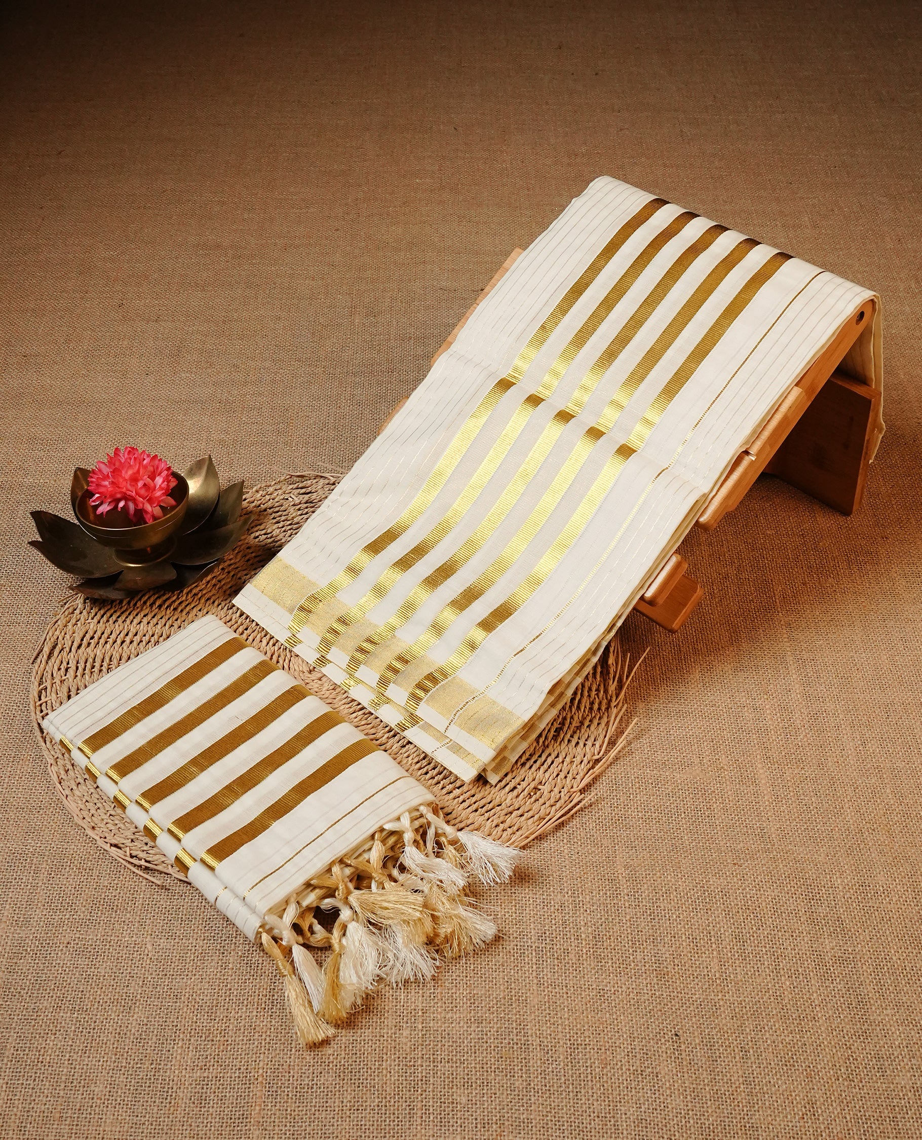 Off white colour Cotton Set Mund featuring a Striped body, enhanced by a Traditional zari border.