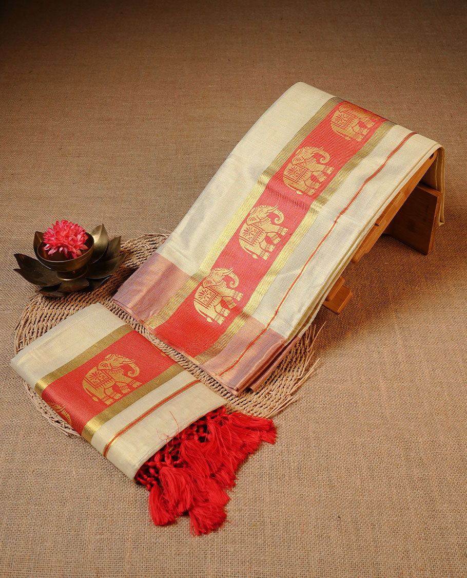 Golden colour Tissue silk set mundu features a plain body accented by a Elephant print on gold zari border.