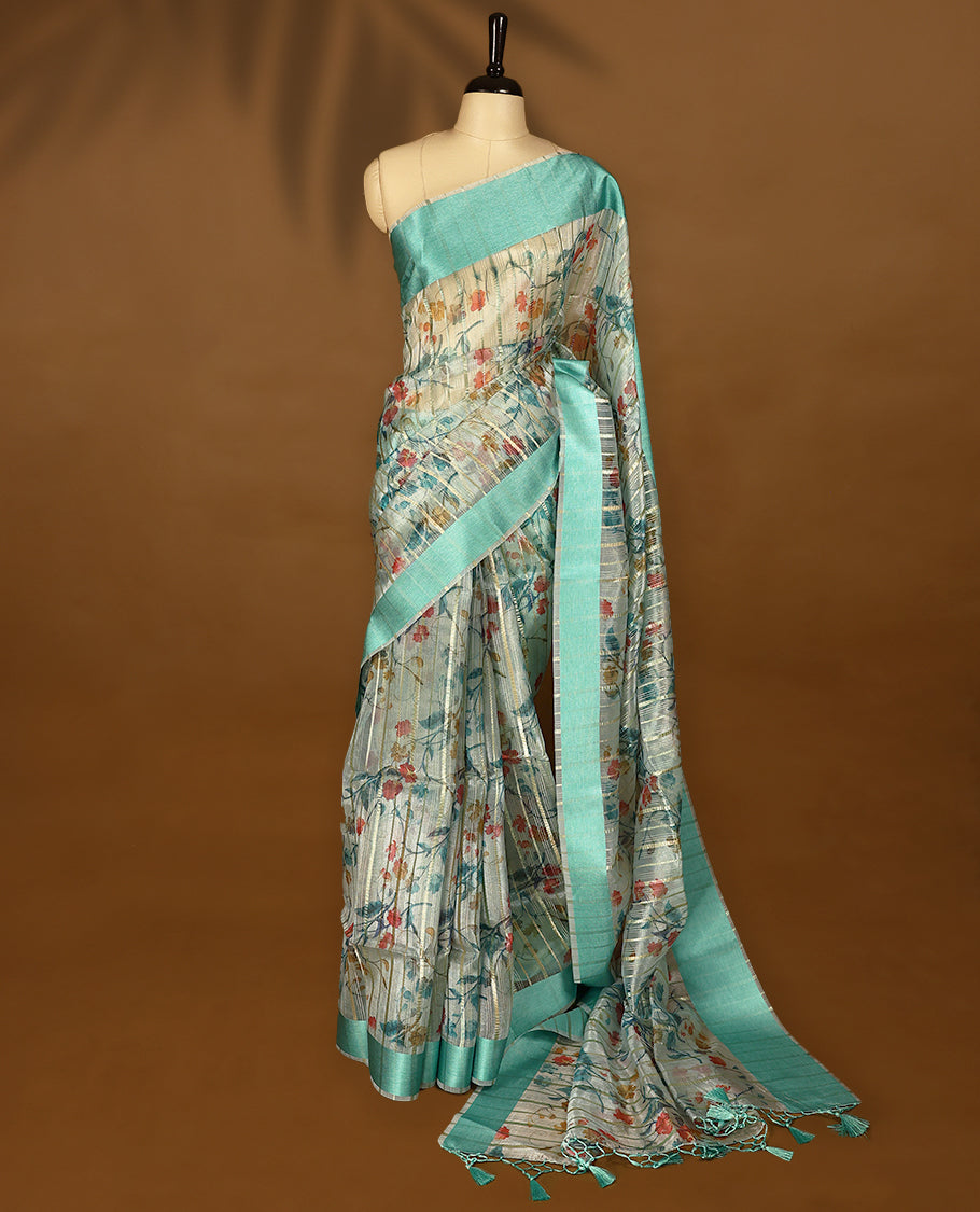 Light aqua semi-organza saree with intricate floral jaal work, elegant border, and a matching silk brocade blouse.