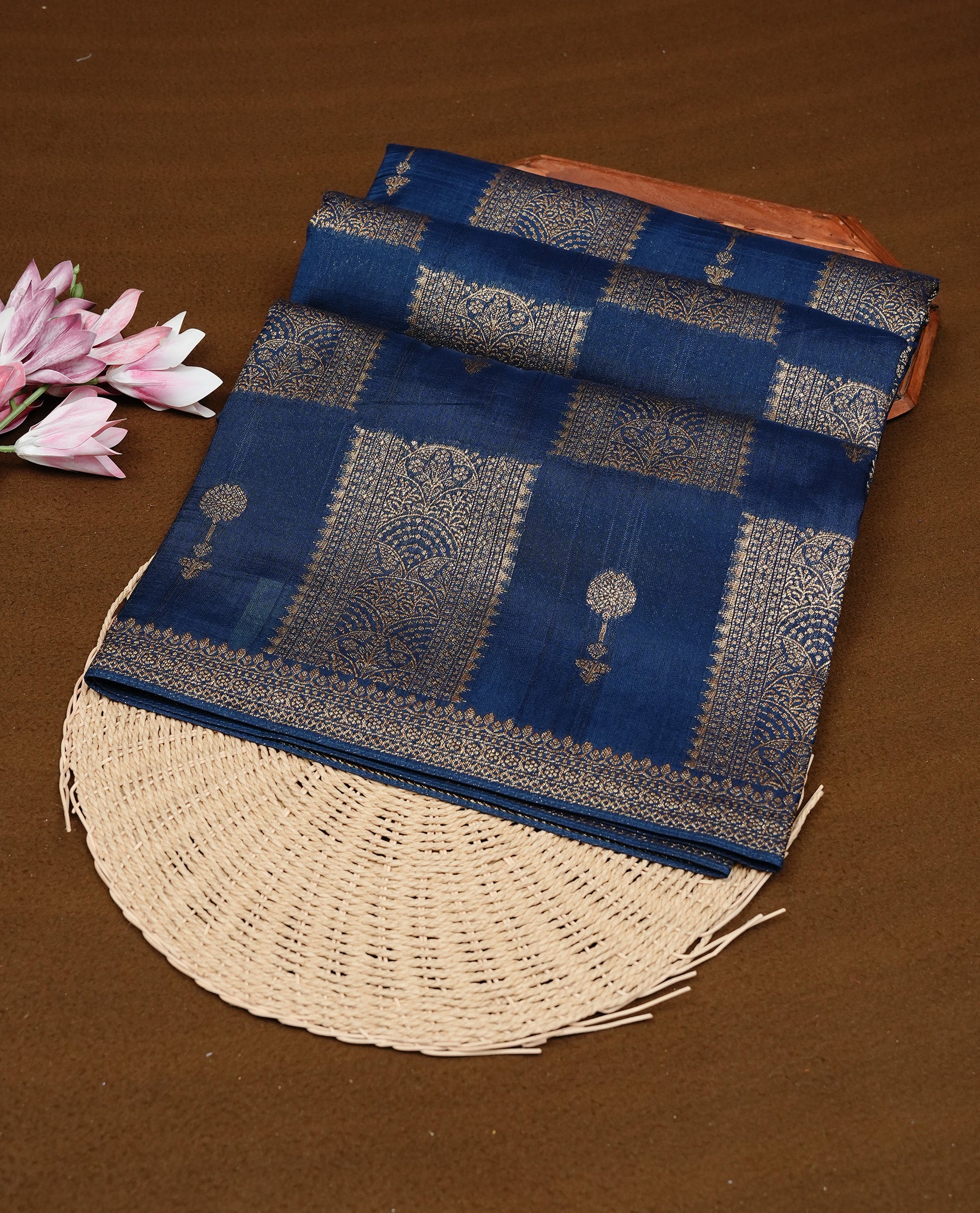 Teal colour Tussar Banaras Georgette silk saree featuring Antique zari Box Pattern on body, complemented by self colour border with zari border, paired with matching blouse piece.