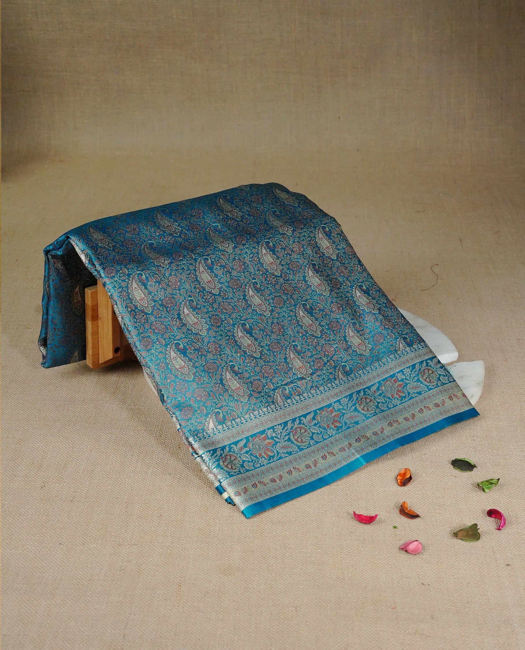 Teal colour Mulberry silk saree featuring gold zari Mango & floral kodi pattern across body, complemented by self colour border with gold zari work, comes with matching blouse piece.