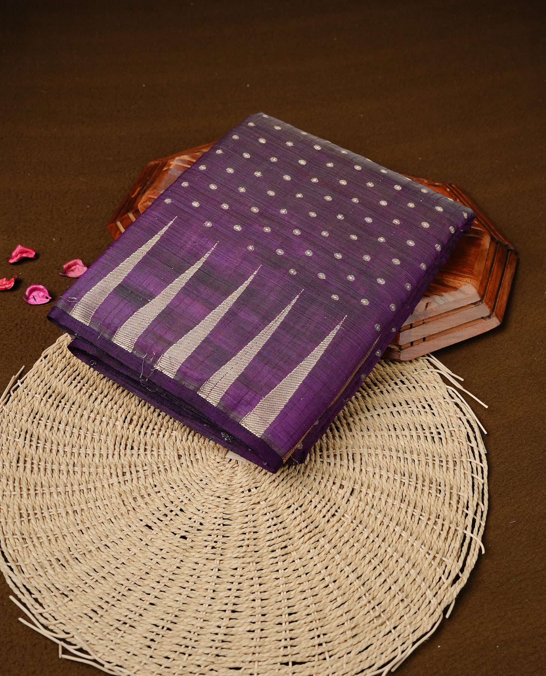 Purple colour semi tussar silk saree featuring gold zari dot motifs all over the body, highlighted by a self colour border with intricate gold zari temple patterns. Comes paired with a matching blouse piece.