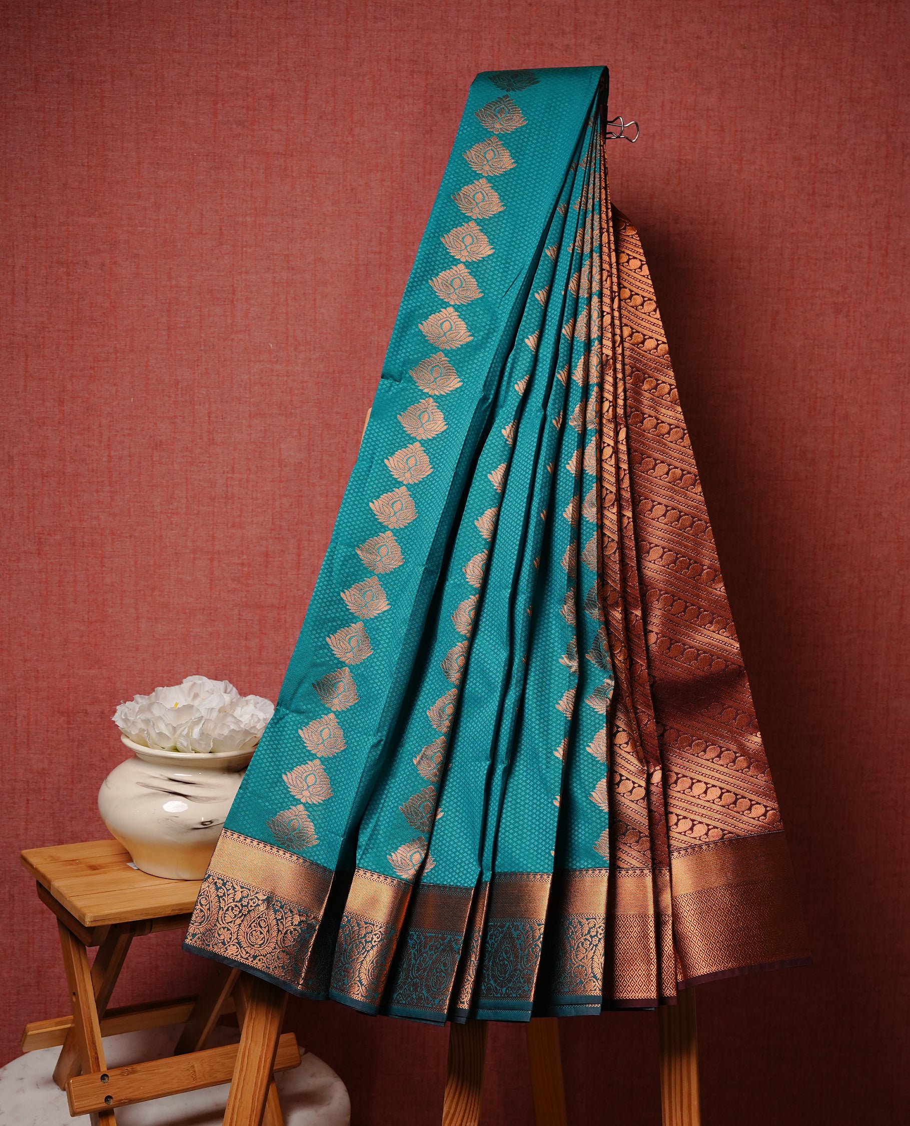 Green colour Semi silk saree Featuring gold zari motifs on body, complemented by Self colour with gold zari border, paired with matching blouse piece.