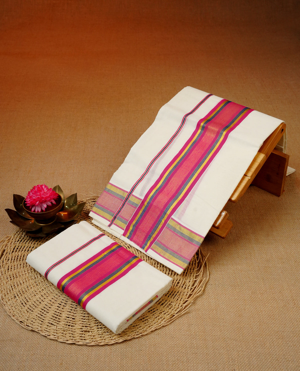 Cream colour cotton set mundu featuring gold & blue, magenta colour kara.