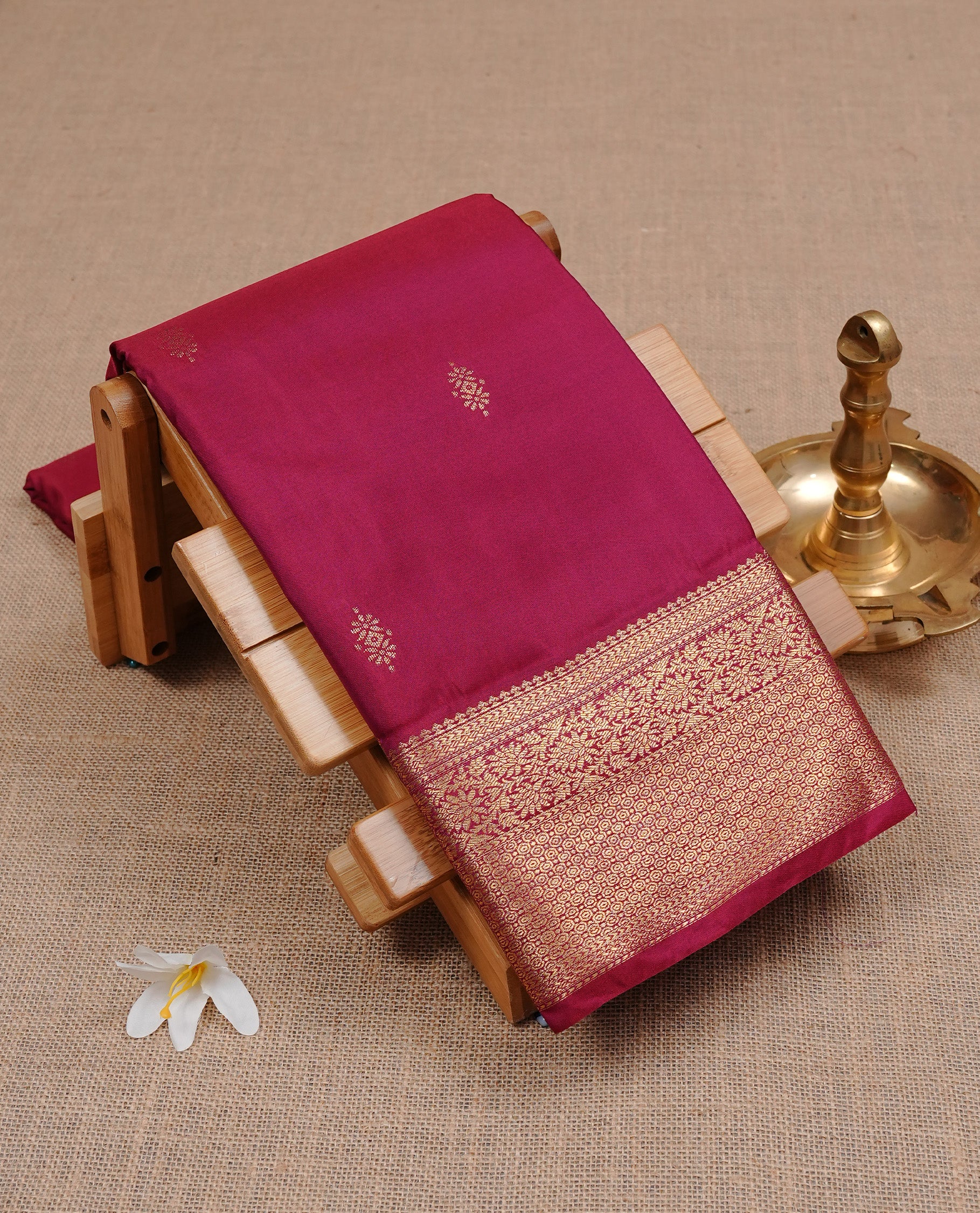 Burgundy Semi Wedding Silk Saree featuring Gold Zari Motifs On body, Complemented with traditional zari with Self colour border, paired with matching blouse piece.