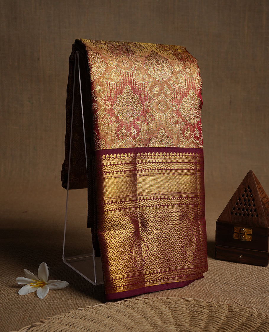 Red & gold double shade colour kancheepuram tissue silk saree highlighting gold zari pattern body, with contrast burgundy colour colour with traditional border and paired with matching blouse.