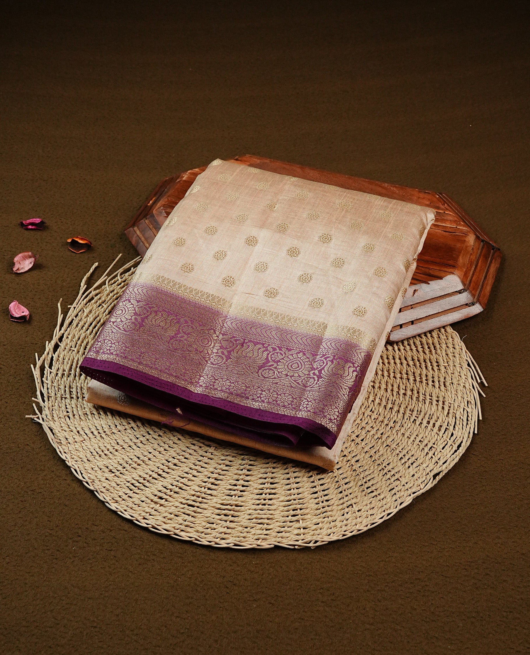 Light Gold Tussar saree featuring Gold zari buttas on body, complemented by contrast Purple Colour with Gold zari border, comes with matching blouse piece.