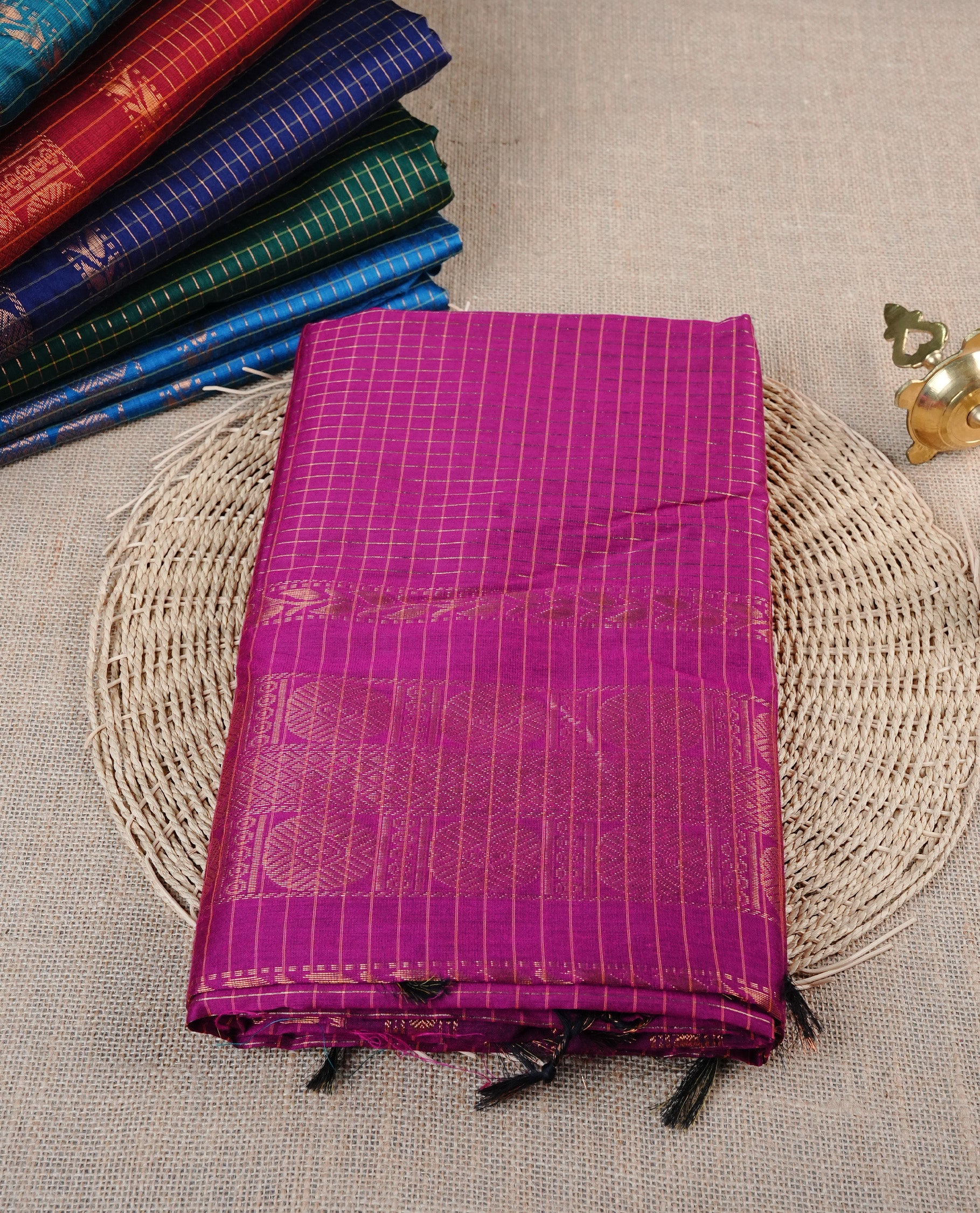 Purple colour Kalyani cotton saree featuring Gold zari checks on body, enhanced with zari border and grand zari pallu, comes with self colour blouse piece.