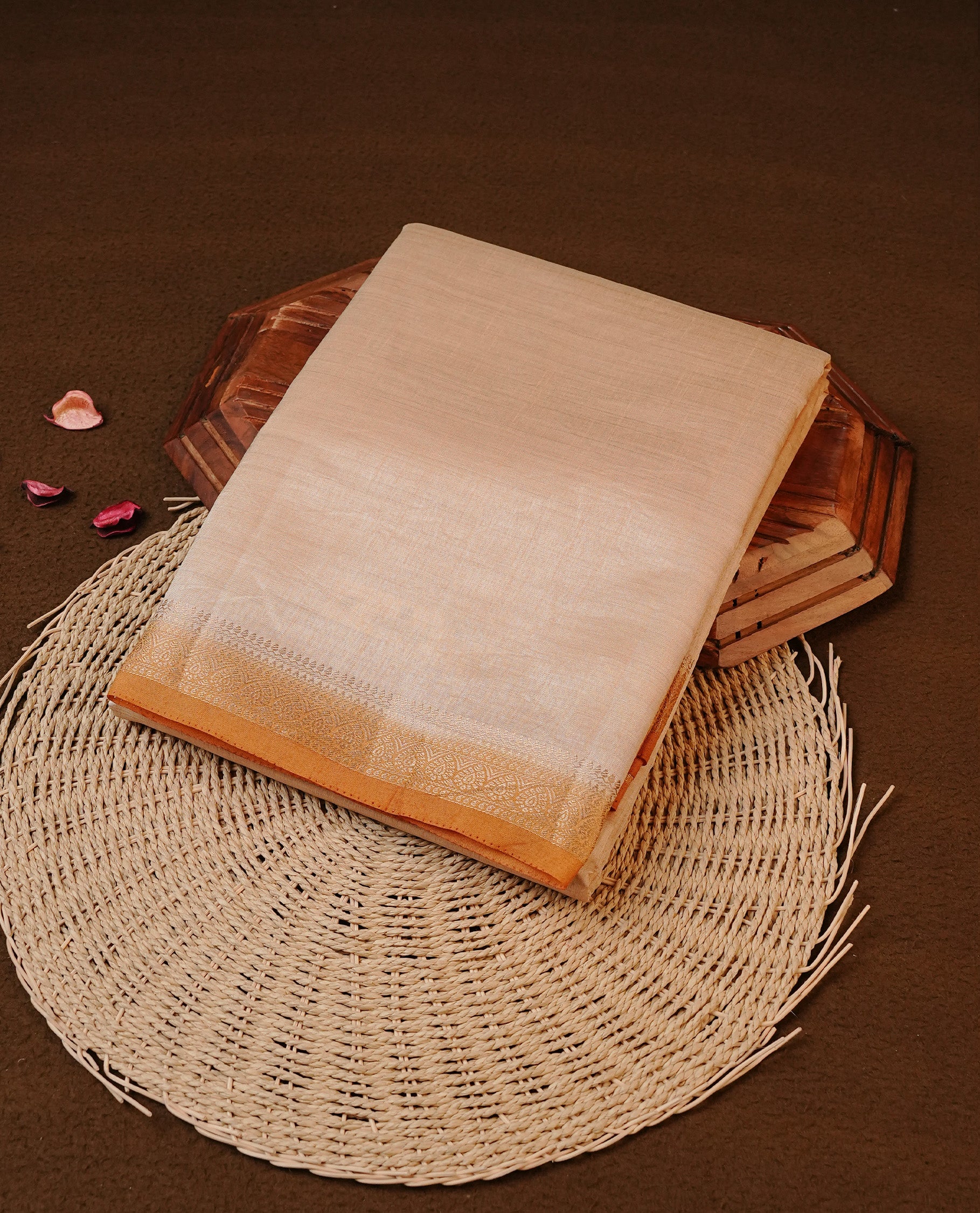 Cream colour Tussar silk saree Featuring Elegant Plain body, complemented by Contrast Mustard colour with gold zari border, paired with matching blouse piece.