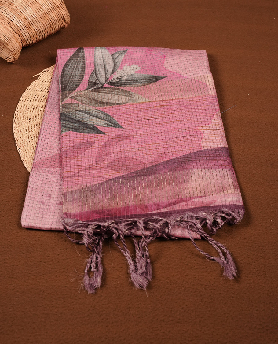 Pink colour semi tussar silk saree featuring floral print across body, contrast pink colour border and pallu, paired with matching blouse piece.