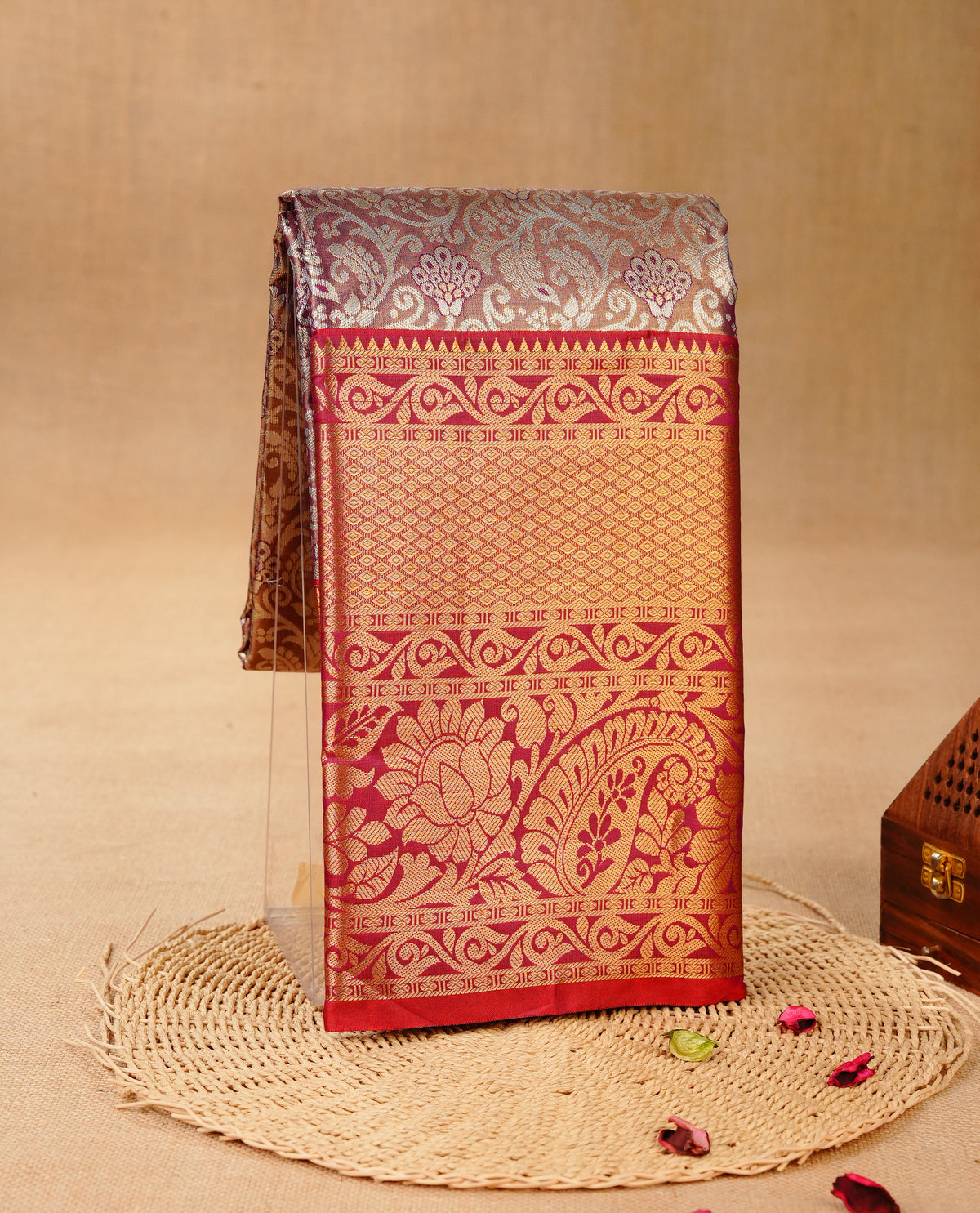 Wine & Gold colour Double shade Semi tissue silk saree featuring Silver zari Floral pattern on body, Contrast Maroon colour with Fancy border, paired with matching.