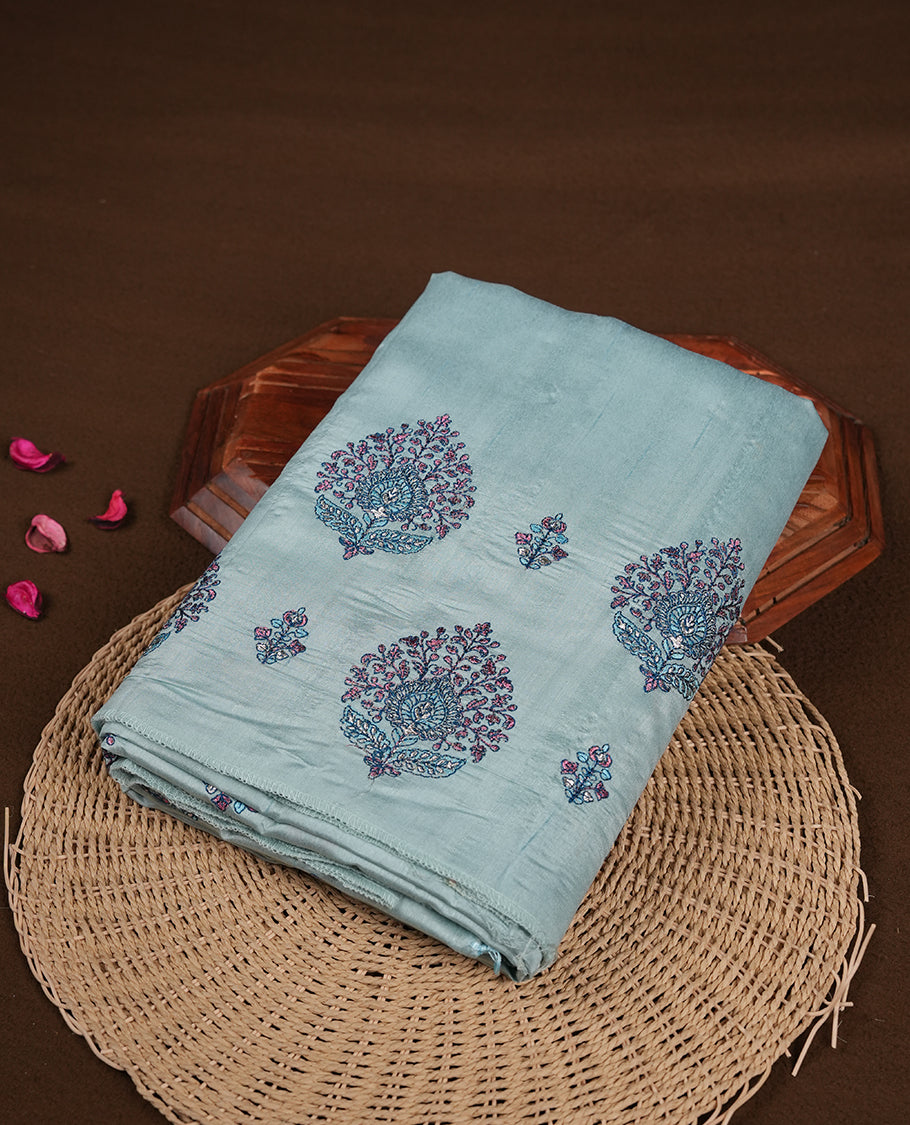 Light blue colour semi tusser silk saree featuring Floral thread embroidery across body, without border and paired with matching blouse.