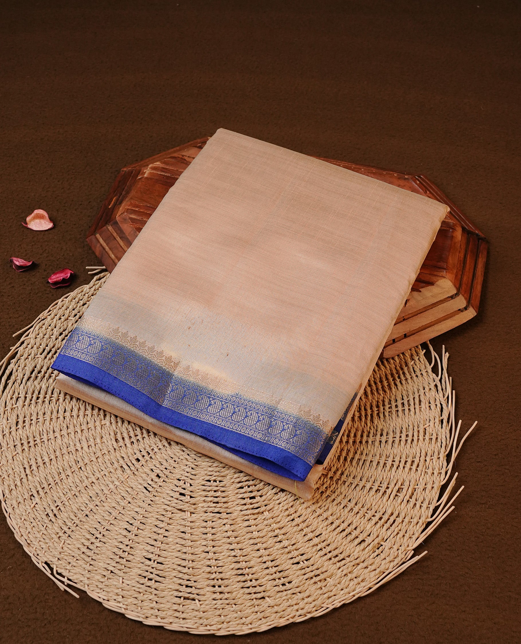 Cream colour Tussar silk saree Featuring Elegant Plain body, complemented by Contrast blue colour with gold zari border, paired with matching blouse piece.