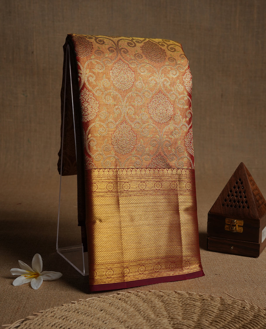 Red & gold double shade colour kancheepuram tissue silk saree highlighting gold kodi zari pattern body, with contrast maroon colour colour with traditional border and paired with matching blouse.