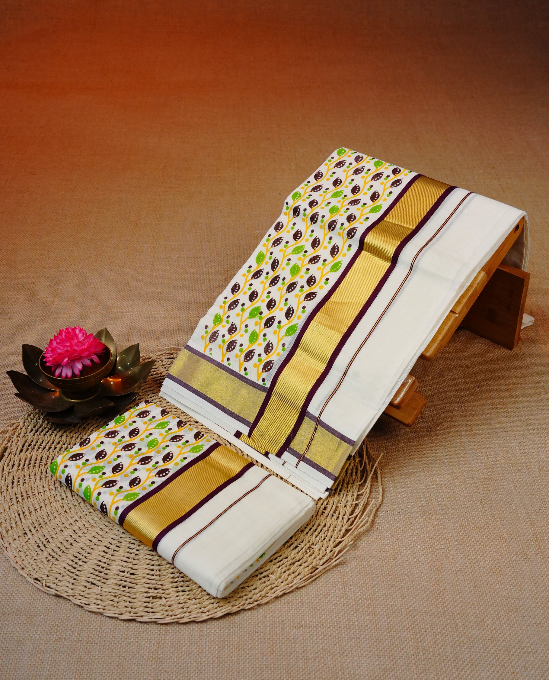 Cream colour cotton set mundu featuring Kasav with Maroon border with Leaf print.