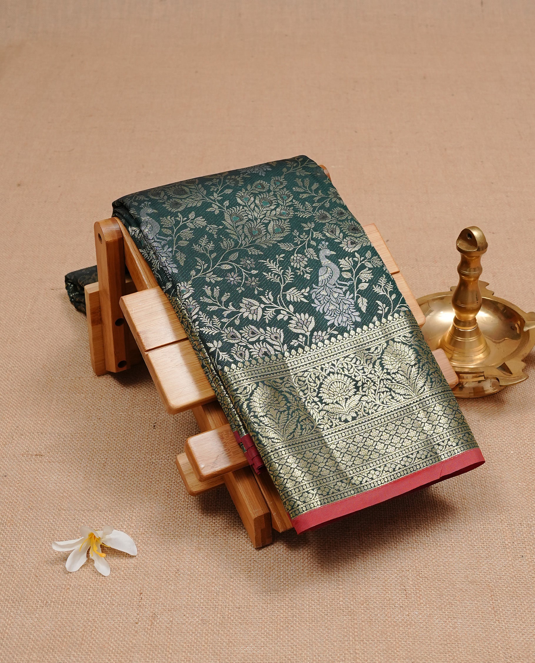Green colour semi wedding silk saree featuring Gold zari Floral kodi pattern with Silver zari peacock motifs on body, complemented gold zari border, paired with matching blouse piece.
