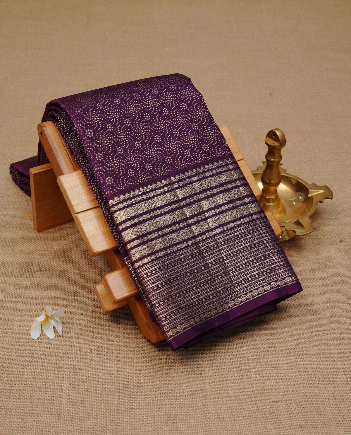 Purple colour Pure wedding silk saree featuring dotted Designed pattern on body, complemented by self colour with traditional border, comes with matching blouse piece.