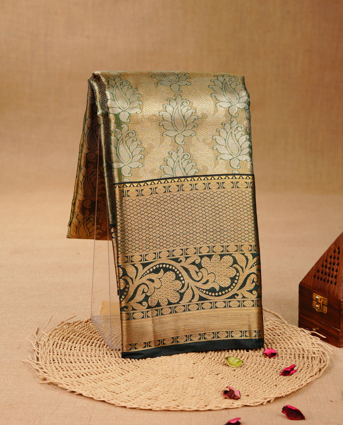 Green & Gold colour Double shade Semi tissue silk saree featuring self color Floral pattern on body, Contrast Green colour with Fancy border, paired with matching.