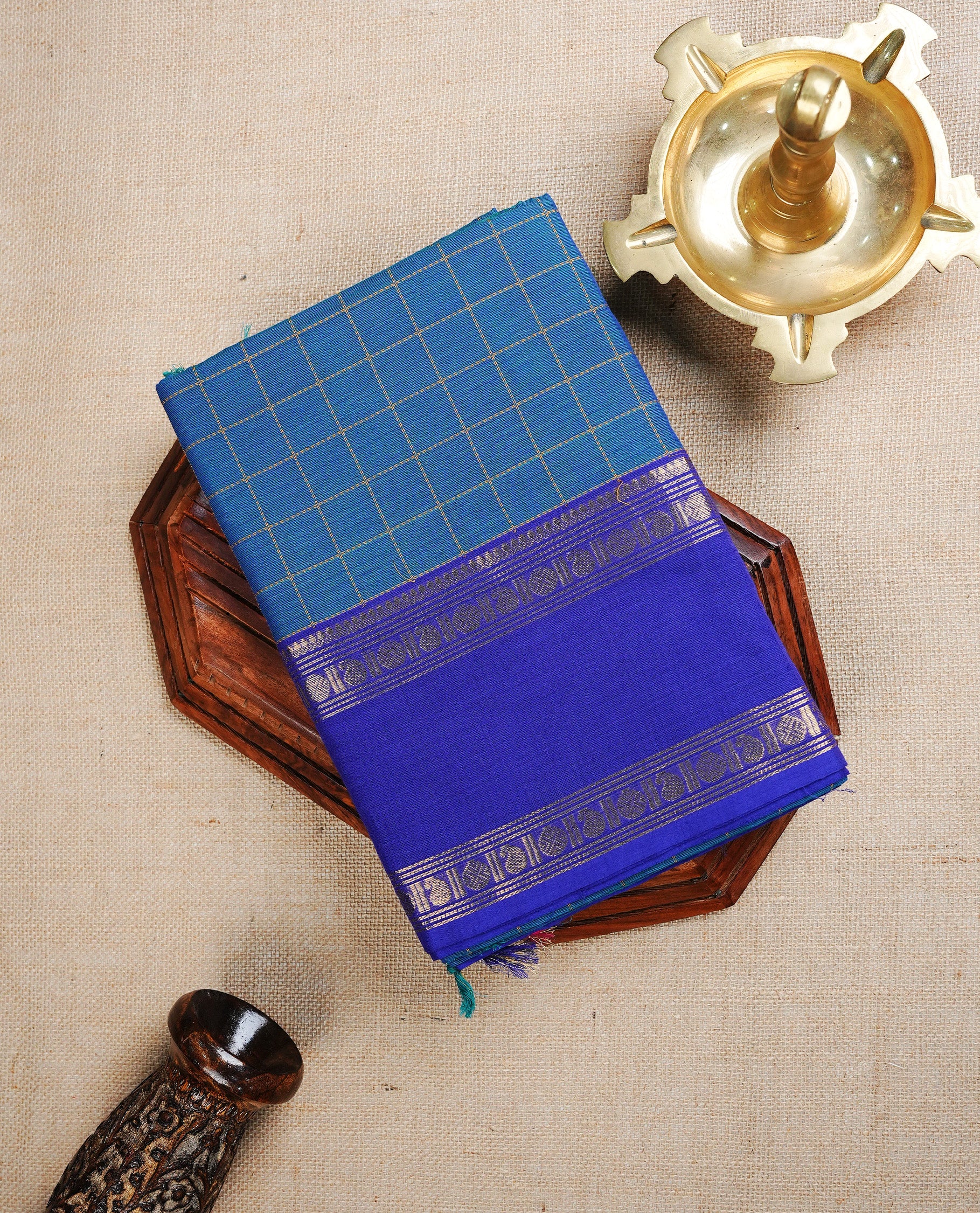 Peacock colour chettinad cotton saree featuring Gold Zari Check Pattern on body, complemented by Contrast Ink Blue Colour With Gold Zari border, paired with matching blouse piece.