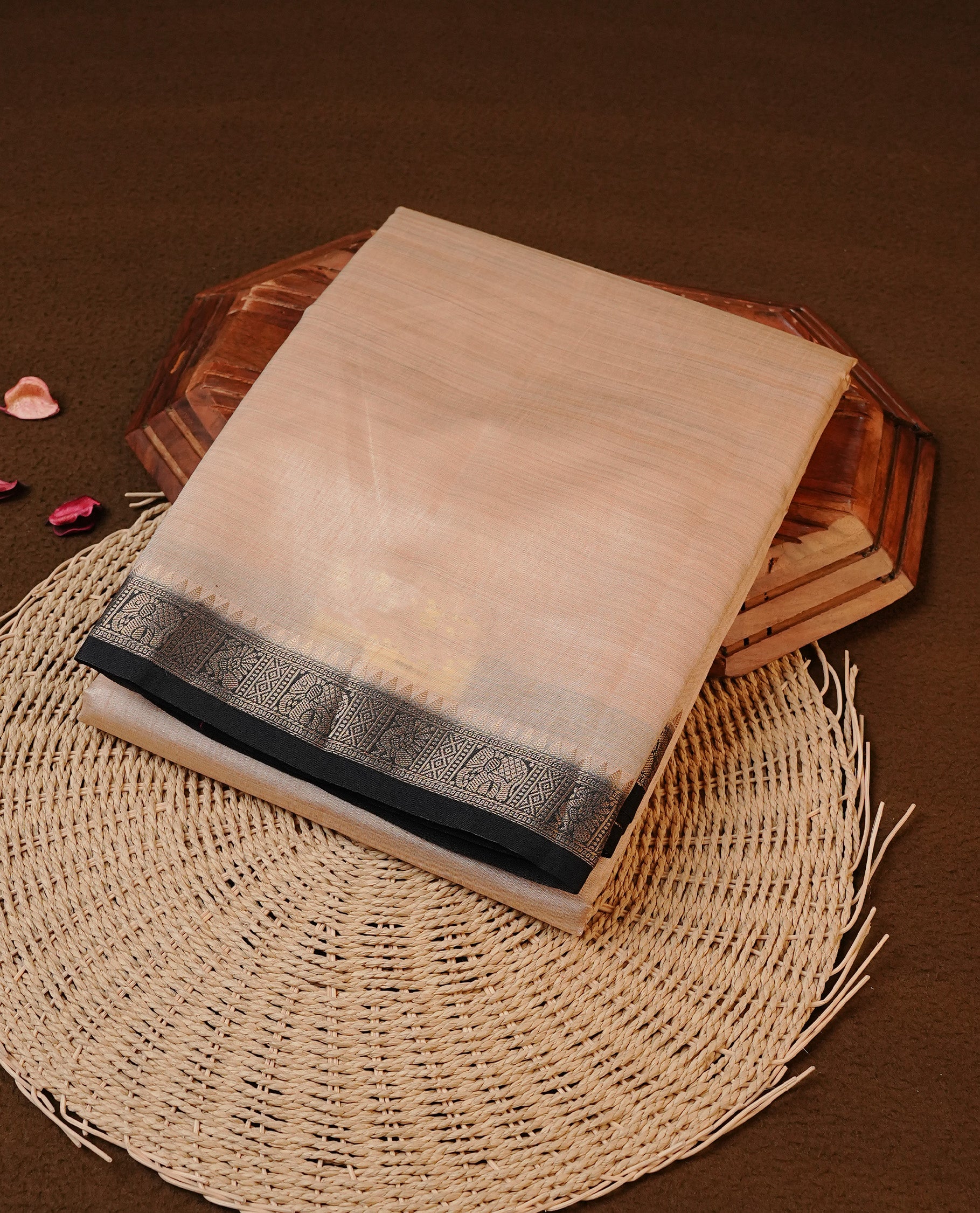 Cream colour Tussar silk saree Featuring Elegant Plain body, complemented by Contrast Black colour with gold zari border, paired with matching blouse piece.