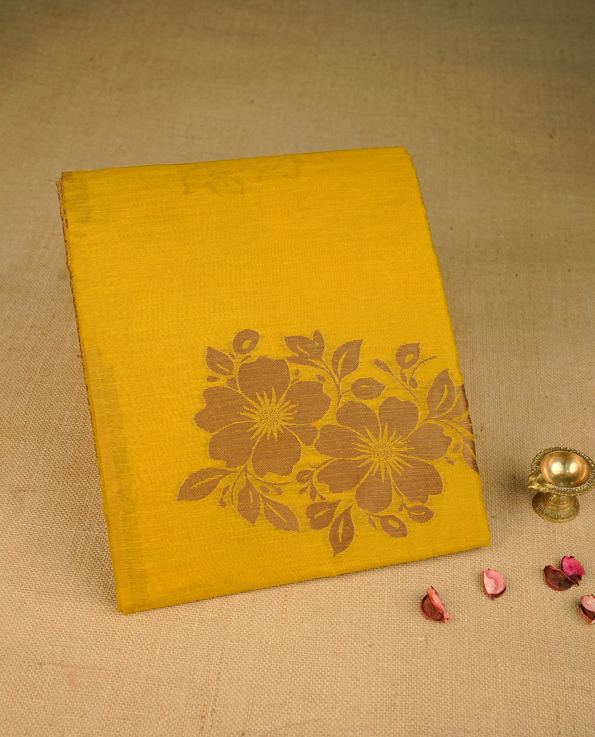 Mustard yellow colour semi linen saree with elegant gold zari floral motifs across the body, complemented by a contrast color grand pallu and a borderless design, paired with a matching blouse piece.
