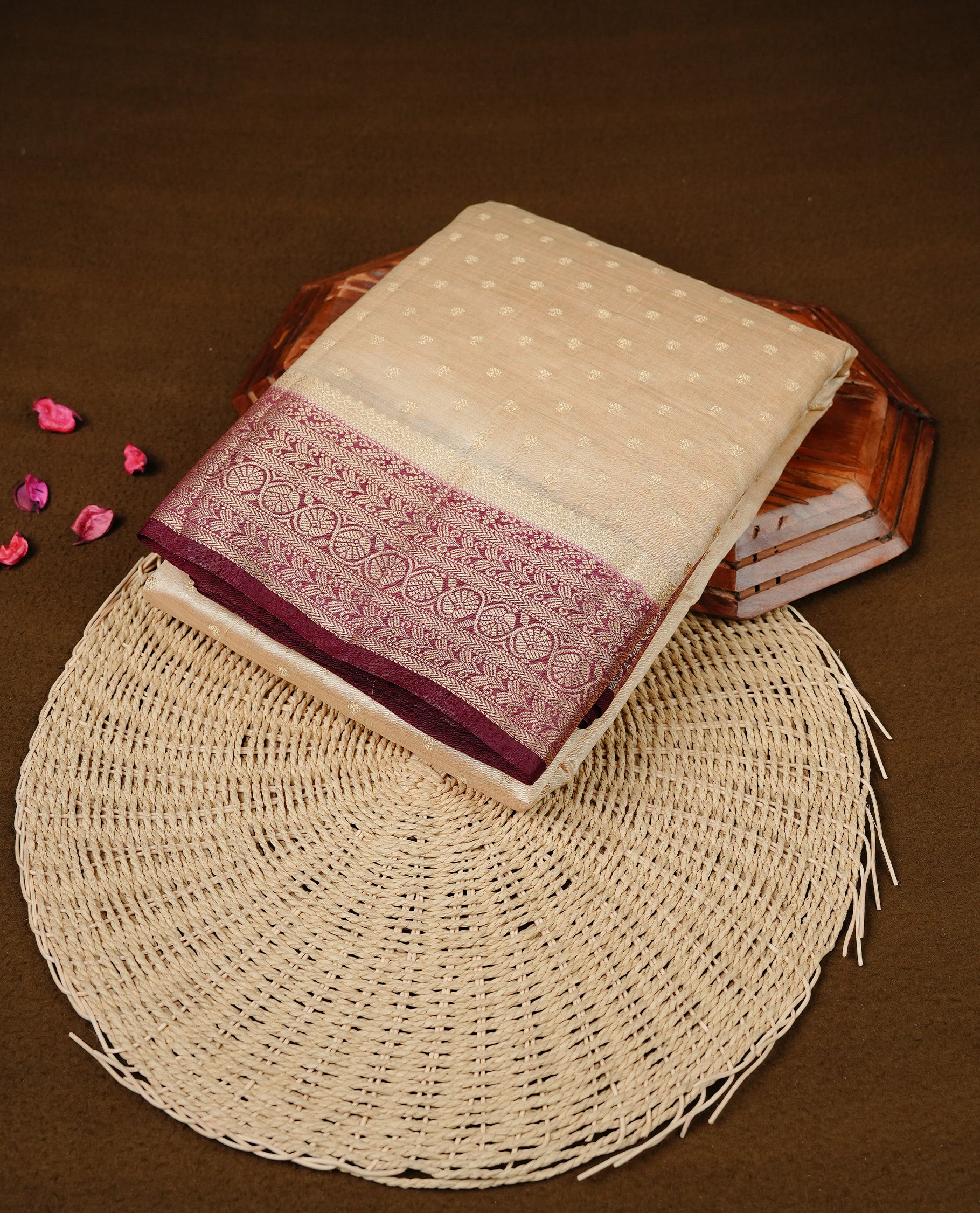 Cream colour Semi Tussar silk saree featuring an Gold zari motifs on body, accentuated by a contrast Maroon border adorned with intricate gold zari work, paired with a matching blouse piece.