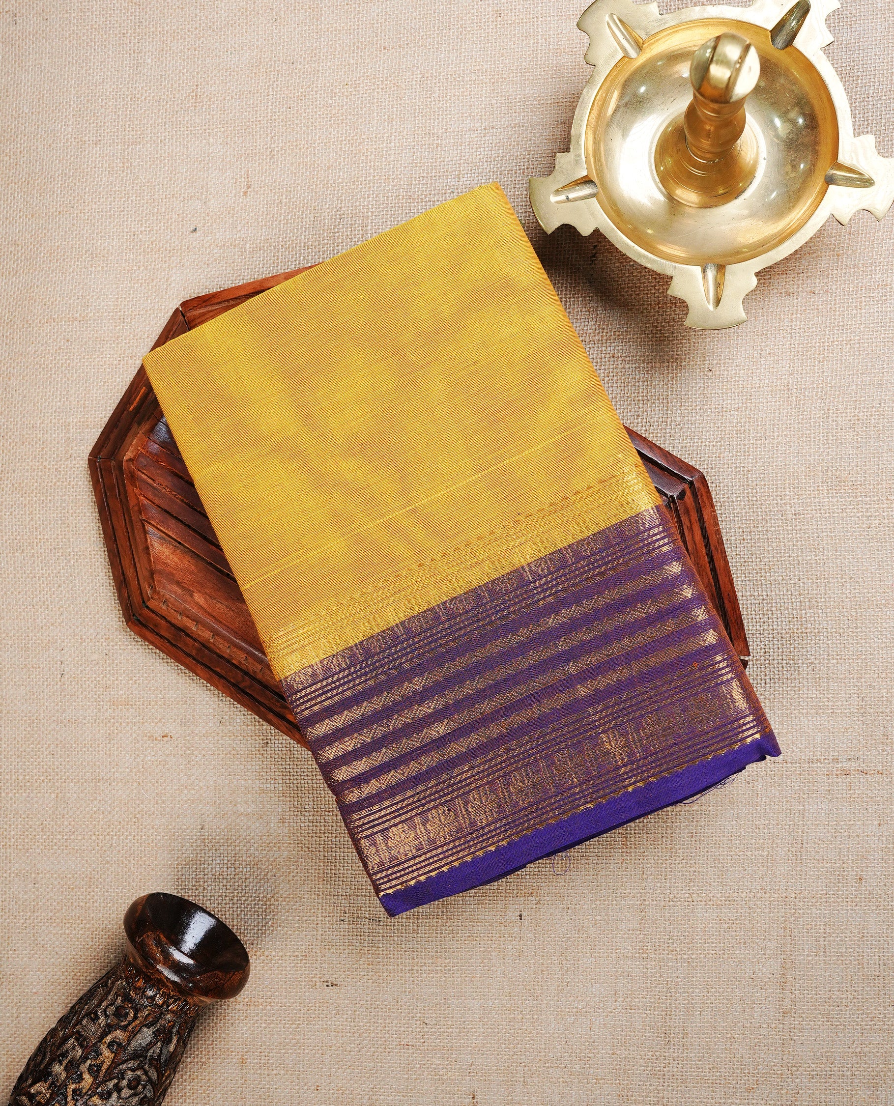 Deep Yellow colour chettinad cotton saree featuring Plain body, complemented by Contrast Purple Colour With Gold Zari border, paired with matching blouse piece.