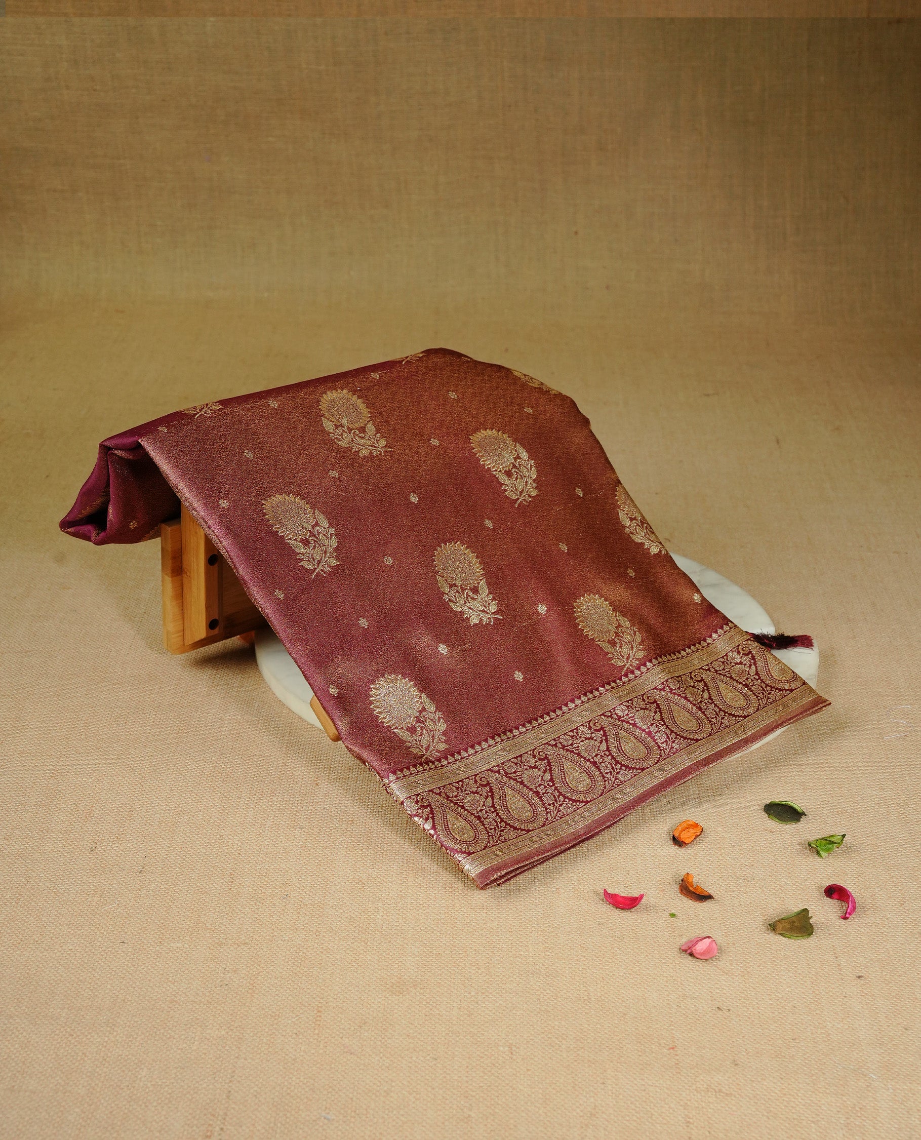 Maroon colour Mulberry silk saree featuring Gold zari small buttas & floral motifs on body, complemented by self colour with Gold zari border, comes with matching blouse piece.