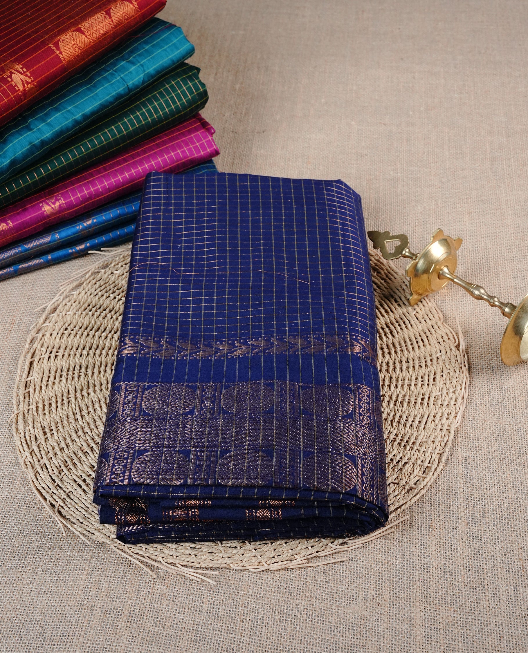 Navy Blue colour Kalyani cotton saree featuring Gold zari checks on body, enhanced with zari border and grand zari pallu, comes with self colour blouse piece.