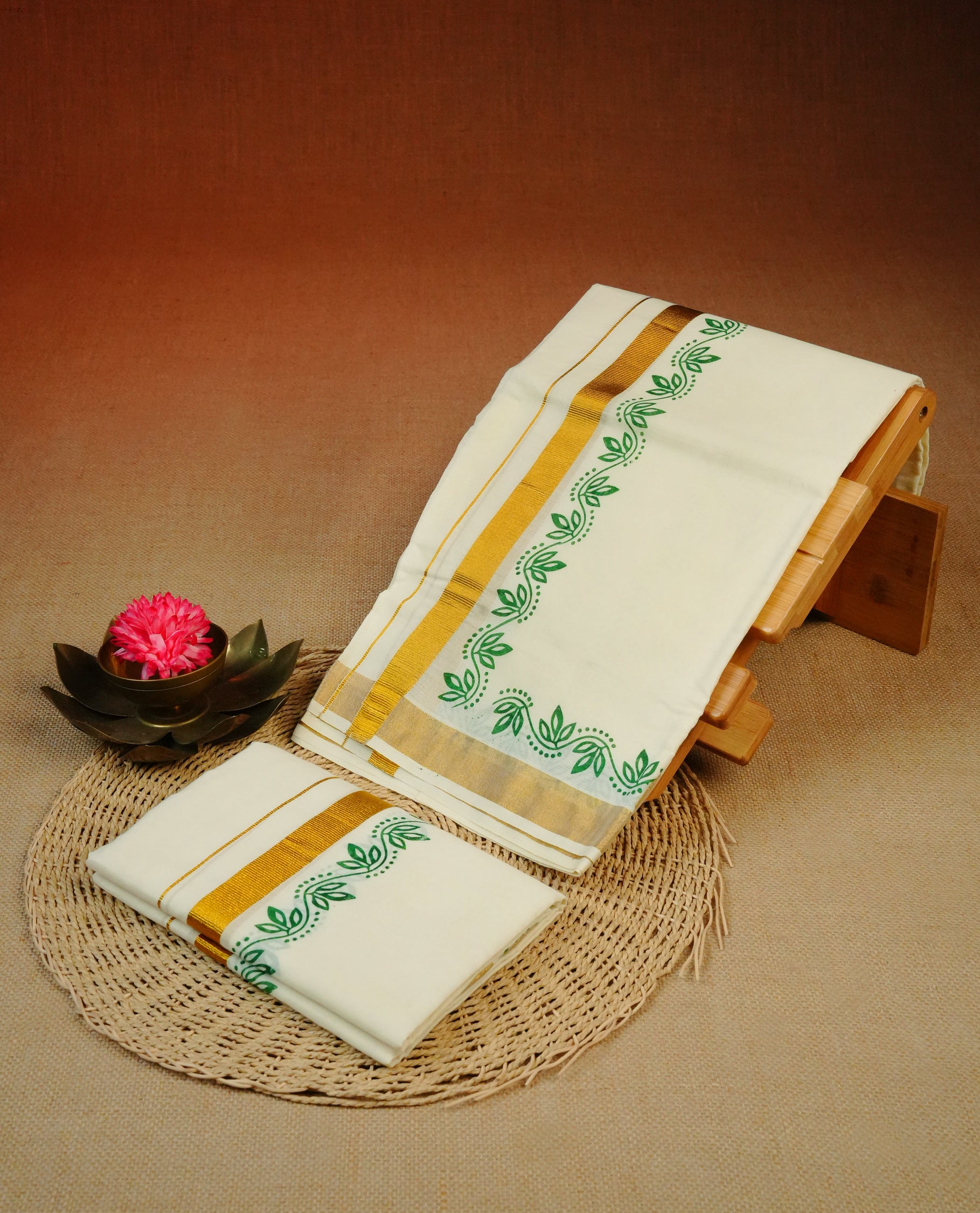 Cream colour Cotton set mundu With plain body, enhance gold zari with Green colour floral kodi kara.