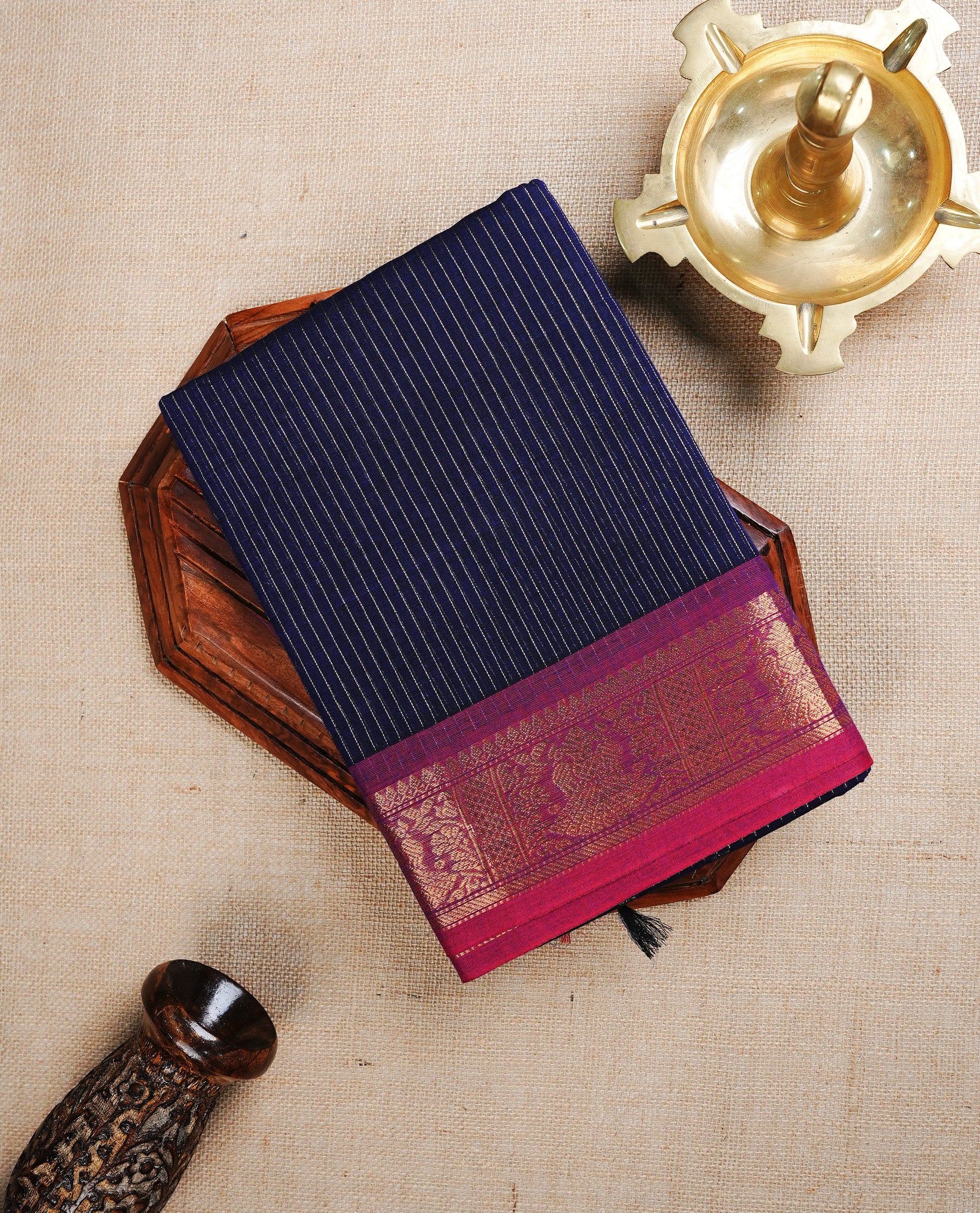 Navy Blue colour chettinad cotton saree featuring Gold Stripes on body, complemented by Contrast Colour With Gold Zari border, paired with matching blouse piece.