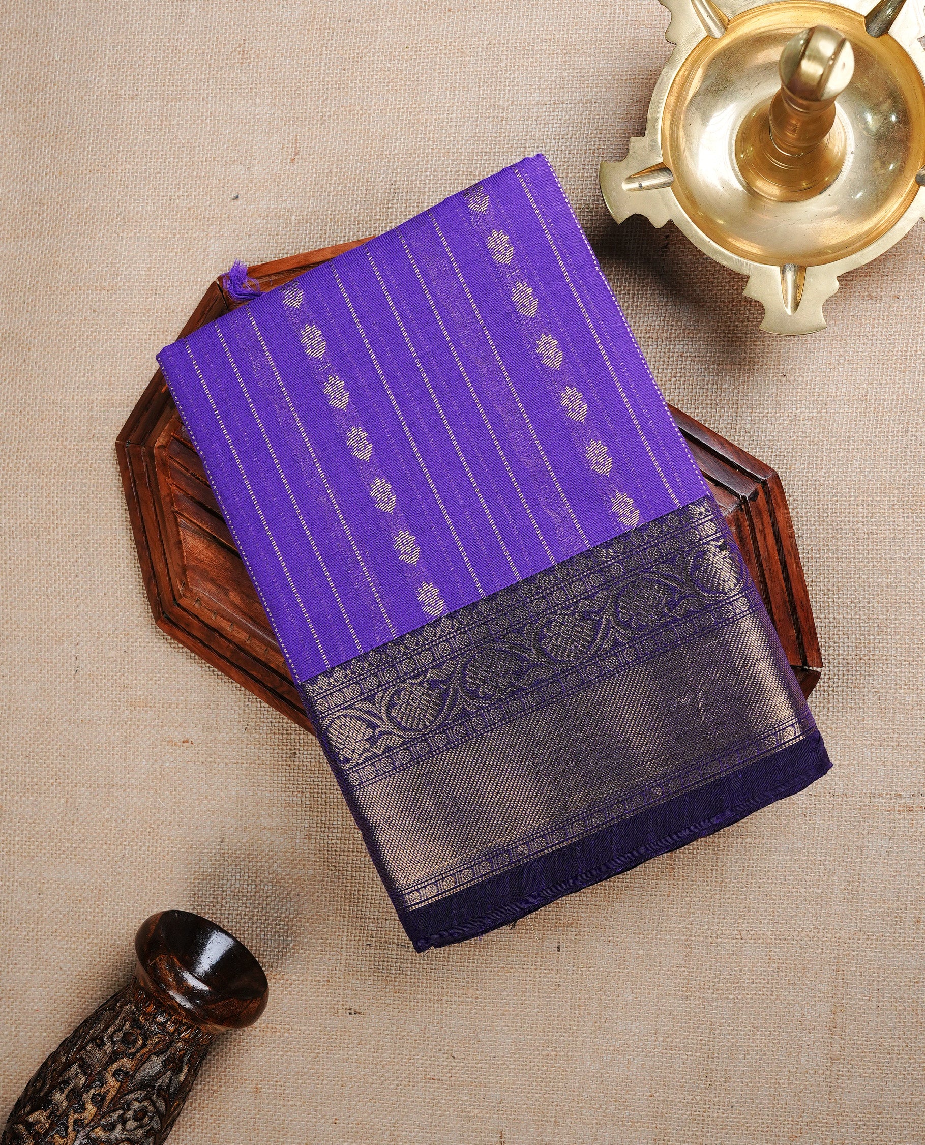 Violet colour chettinad cotton saree featuring Stripes on body, complemented by Contrast Purple Colour With Gold Zari border, paired with matching blouse piece.