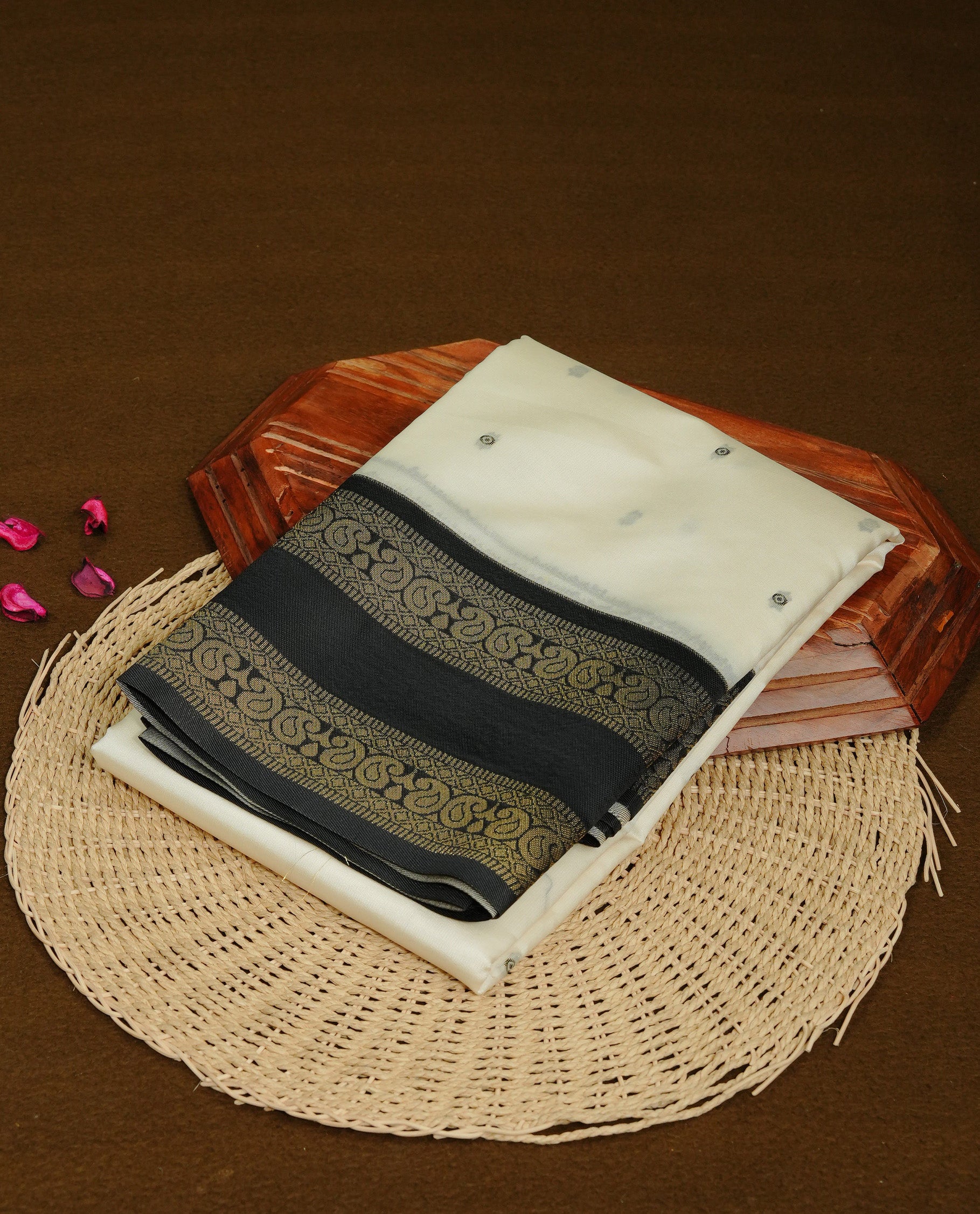 Off White Colour Semi Silk Saree Featuring Black thread buttas On Body, Highlighted by contrast border with Mango motifs, paired with matching blouse piece.