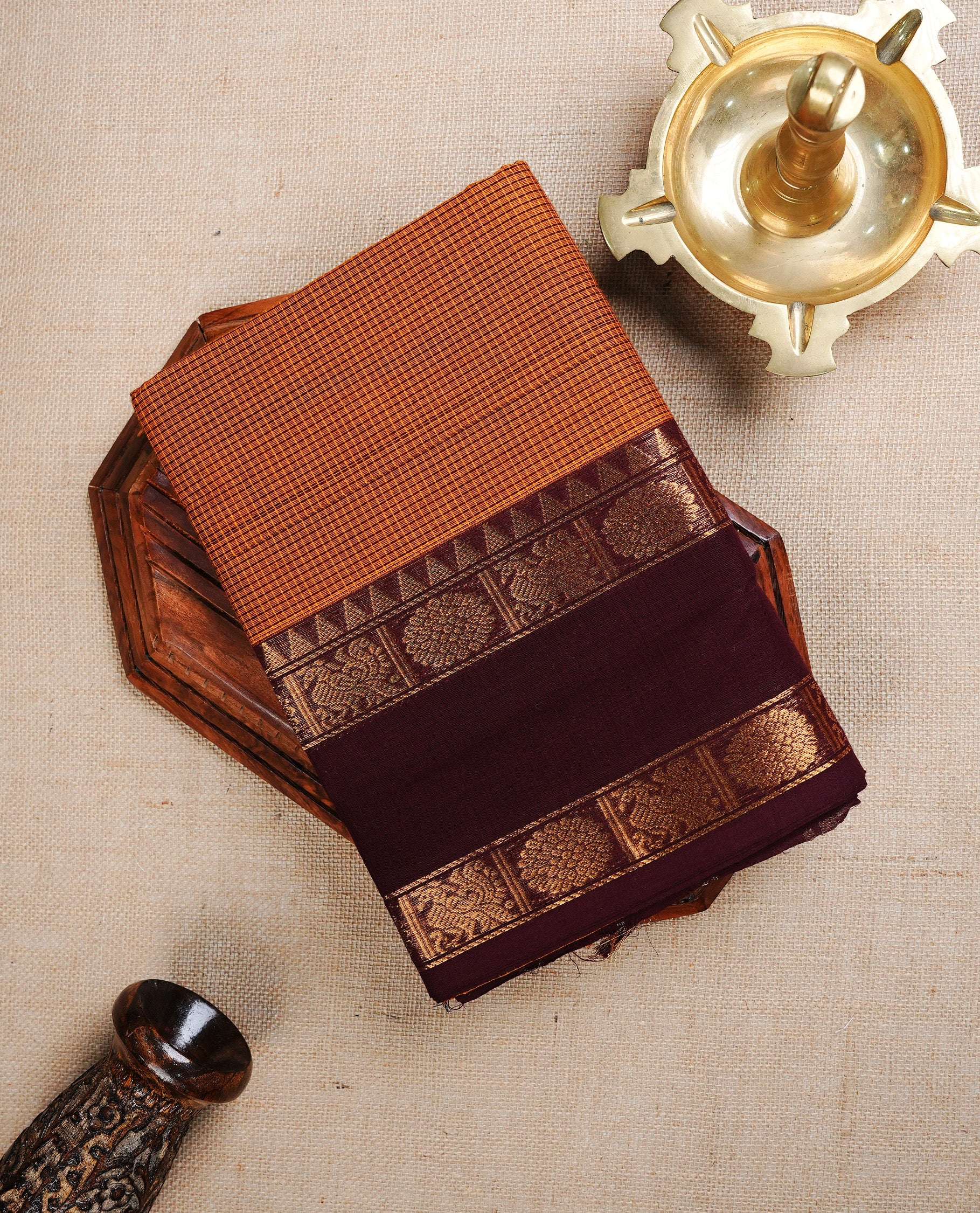 Mustard colour chettinad cotton saree featuring Brown Check Patterns On body, complemented by Contrast Brown Colour With Peacock & Chakra Gold Zari border, paired with matching blouse piece.