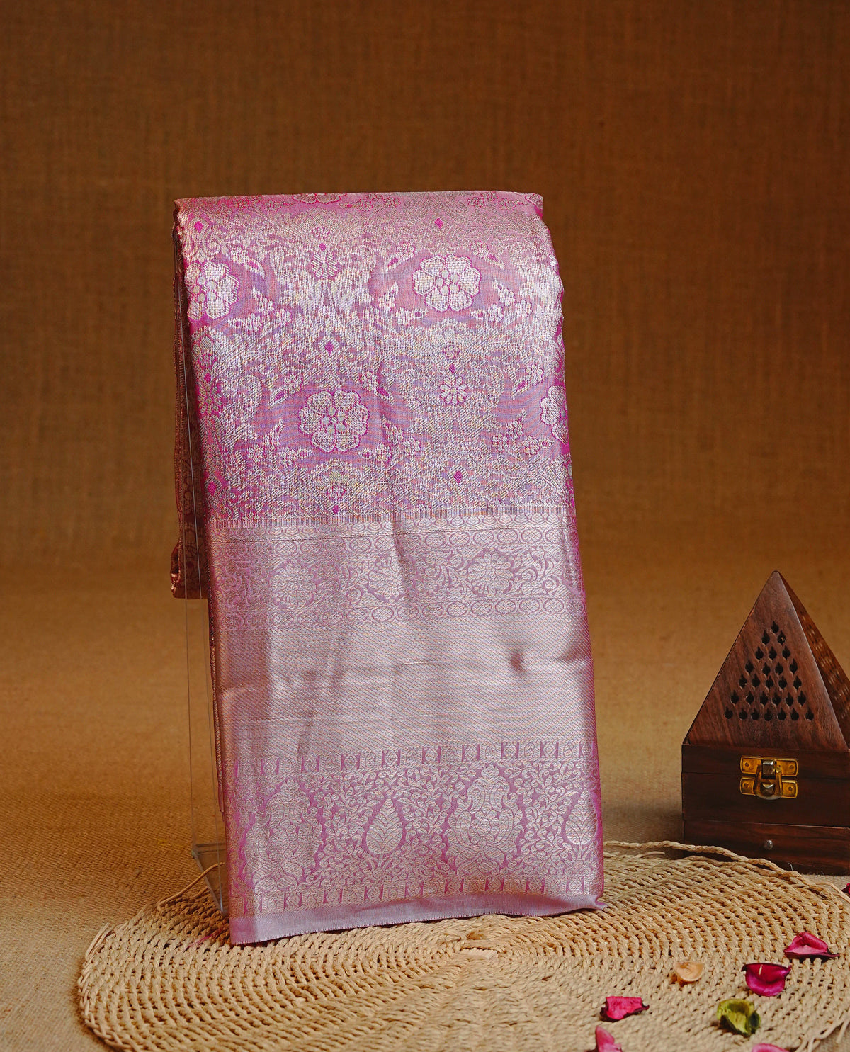 Pink colour Semi Tissue Silk saree featuring Light gold Kodi pattern on body, complemented by Sel colour with gold zari border, paired with matching blouse piece.