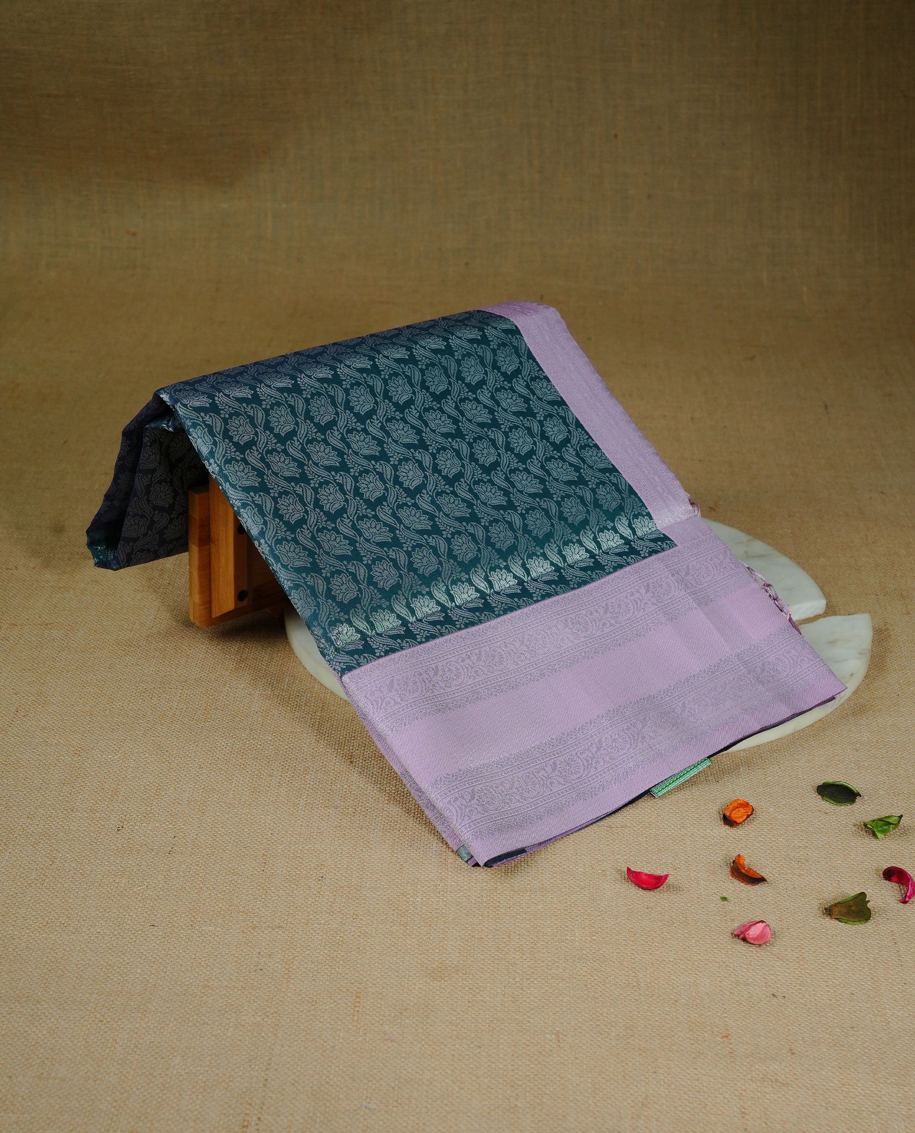 Green colour semi silk saree featuring Silver zari pattern on body, complemented by contrast Pink colour with silver zari border, comes with matching blouse piece.