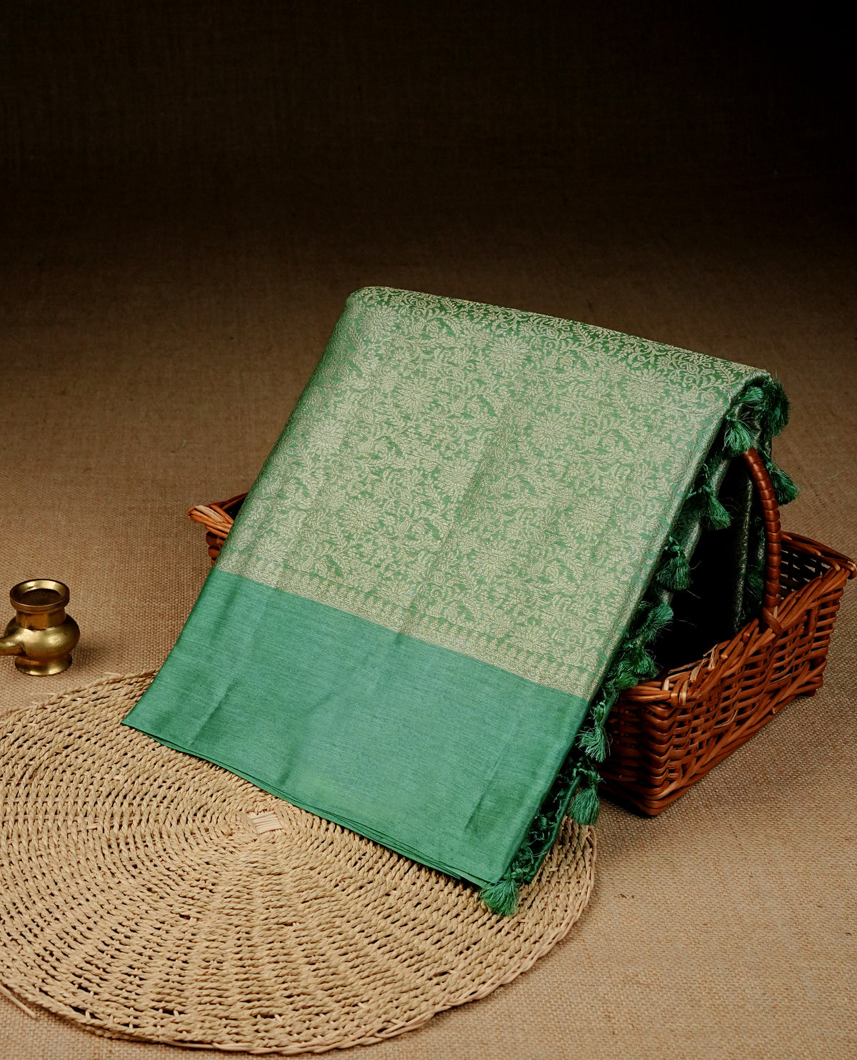 Pastel green Colour banaras saree featuring Light gold zari Floral kodi pattern on body, complemented by borderless finish, comes with matching blouse piece.