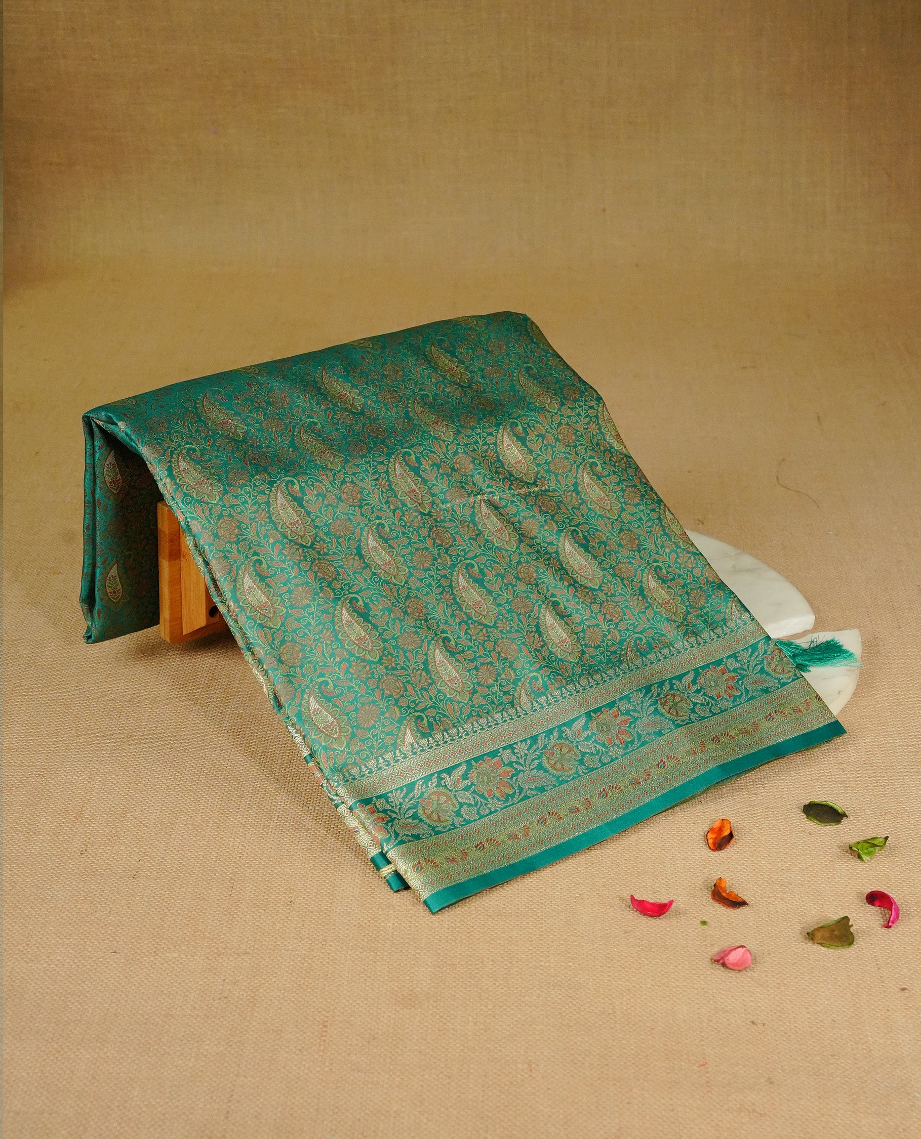 Green colour Mulberry silk saree featuring gold zari Mango & floral kodi pattern across body, complemented by self colour border with gold zari work, comes with matching blouse piece.