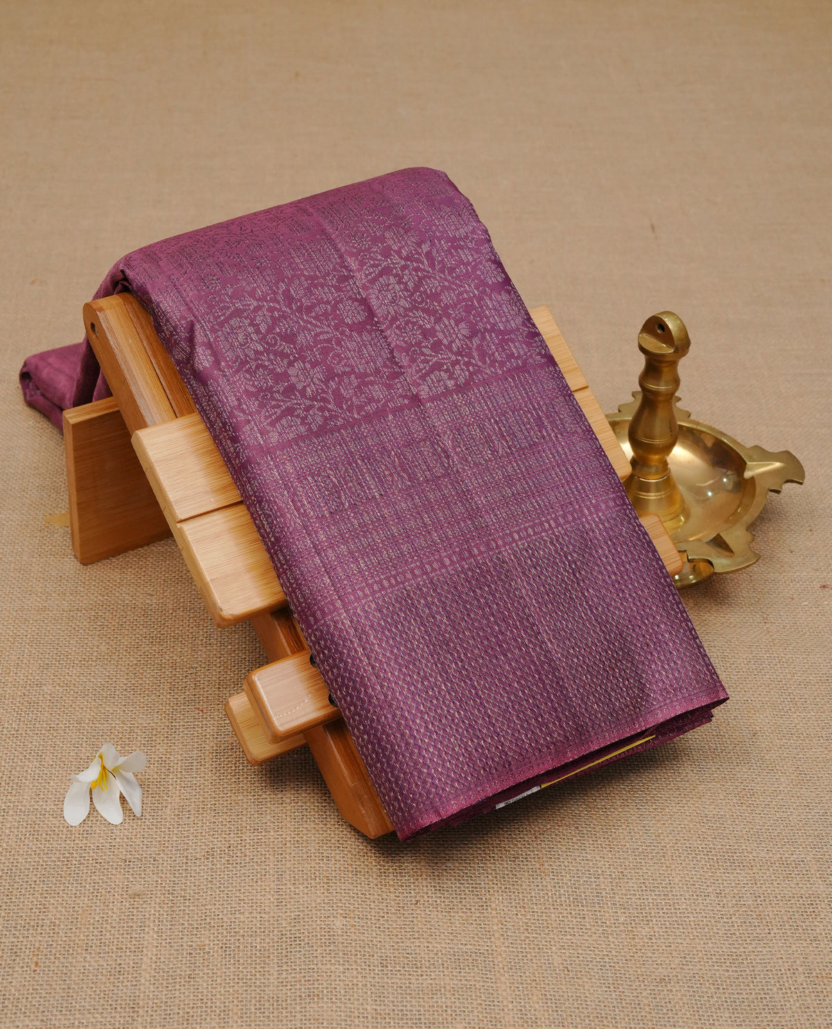 Mauve colour pure wedding silk saree featuring antique zari Floral kodi pattern on body, complemented by self colour with traditional border, comes with matching blouse piece.
