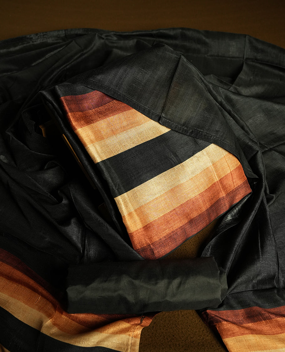 Black colour churidhar material featuring elegant horizontal stripes on the yoke and dupatta, woven in shades of Brown and Black & Paired with a matching plain bottom