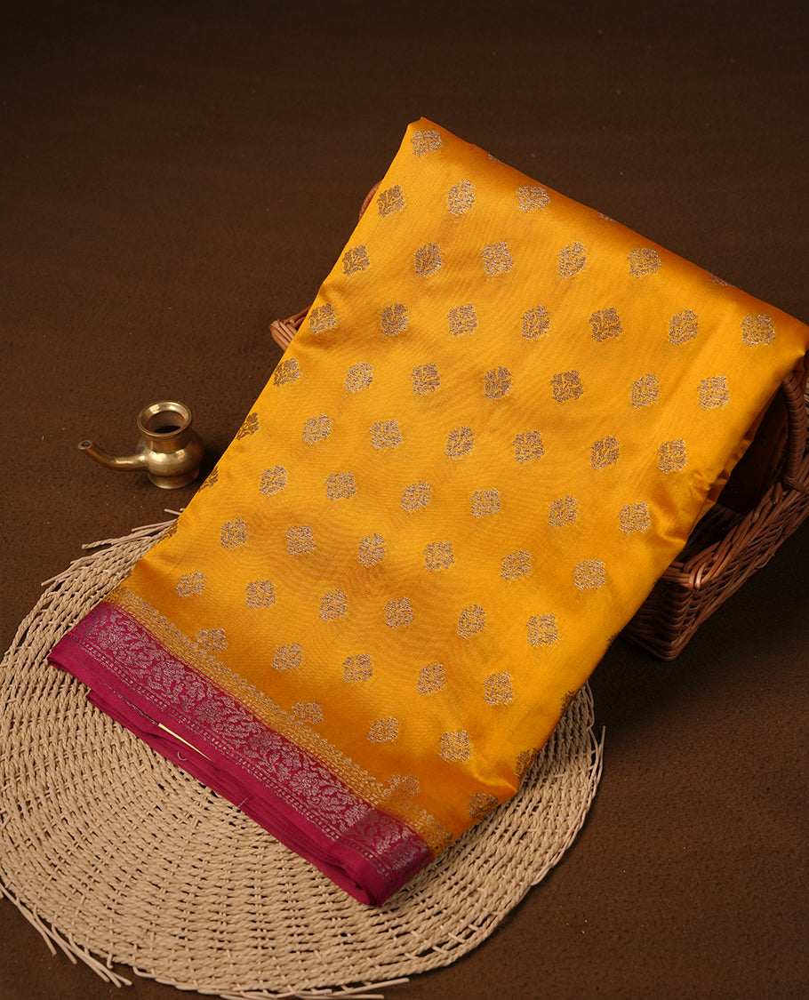 Yellow colour Pure tussar Banarasi saree featuring Gold zari motifs on body, by contrast magenta purple colour with gold zari border, and a matching blouse piece.