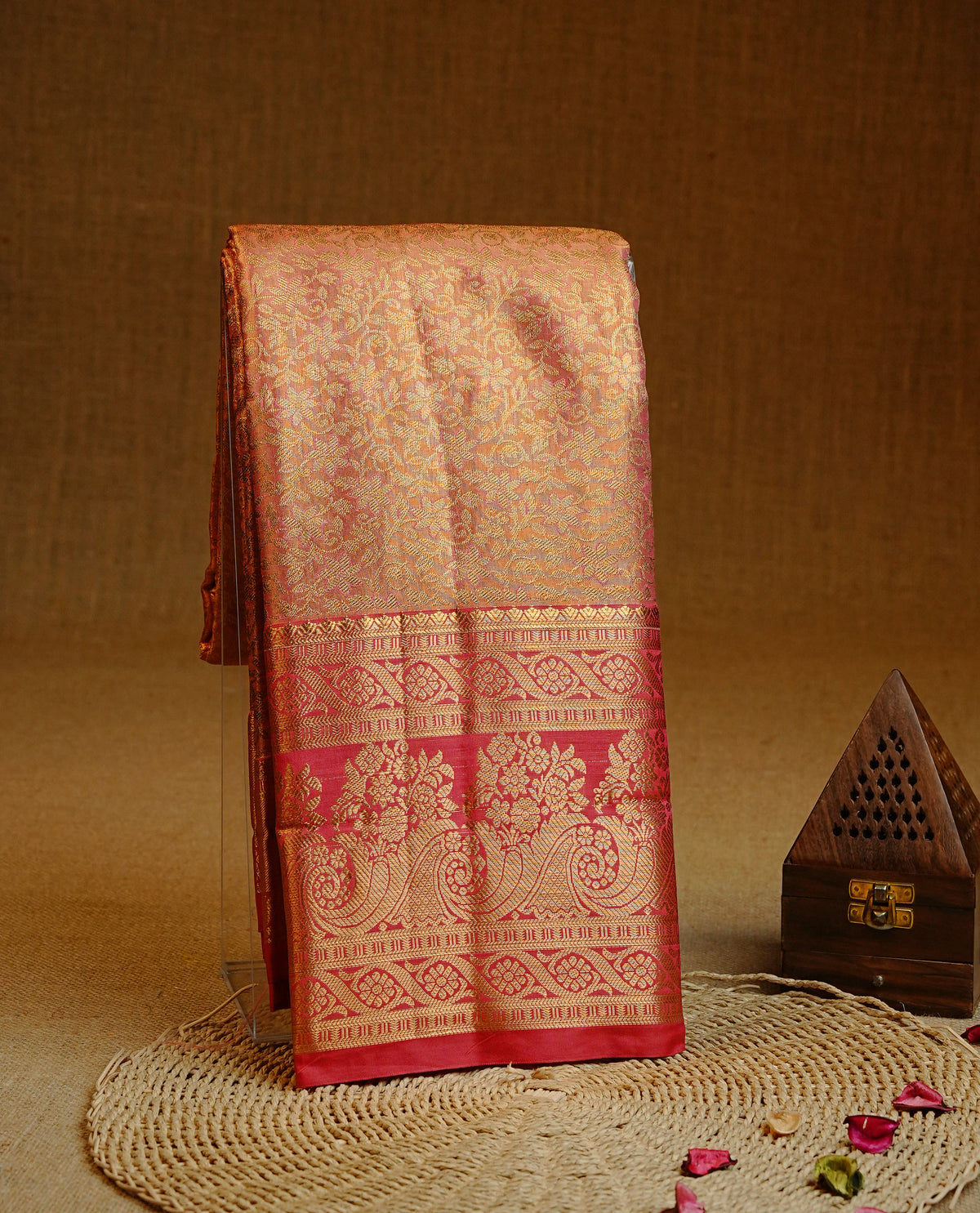Mauve colour Semi tissue silk saree featuring Gold zari kodi floral motifs on body, Contrast Red colour with traditional border, paired with matching blouse piece.