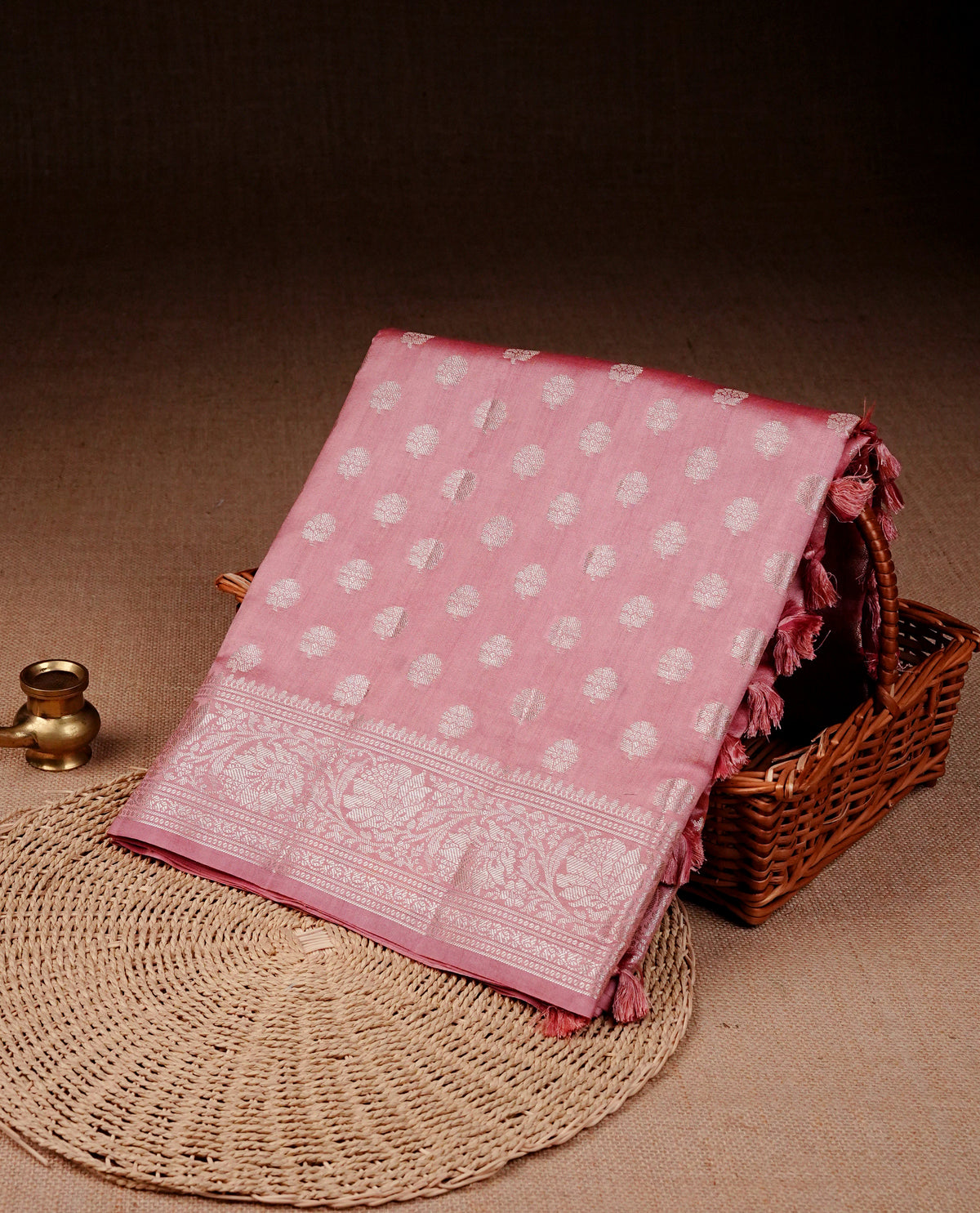 Light Pink colour banaras saree featuring silver zari buttas on body, complemented silver zari on self colour border, comes with matching blouse piece.