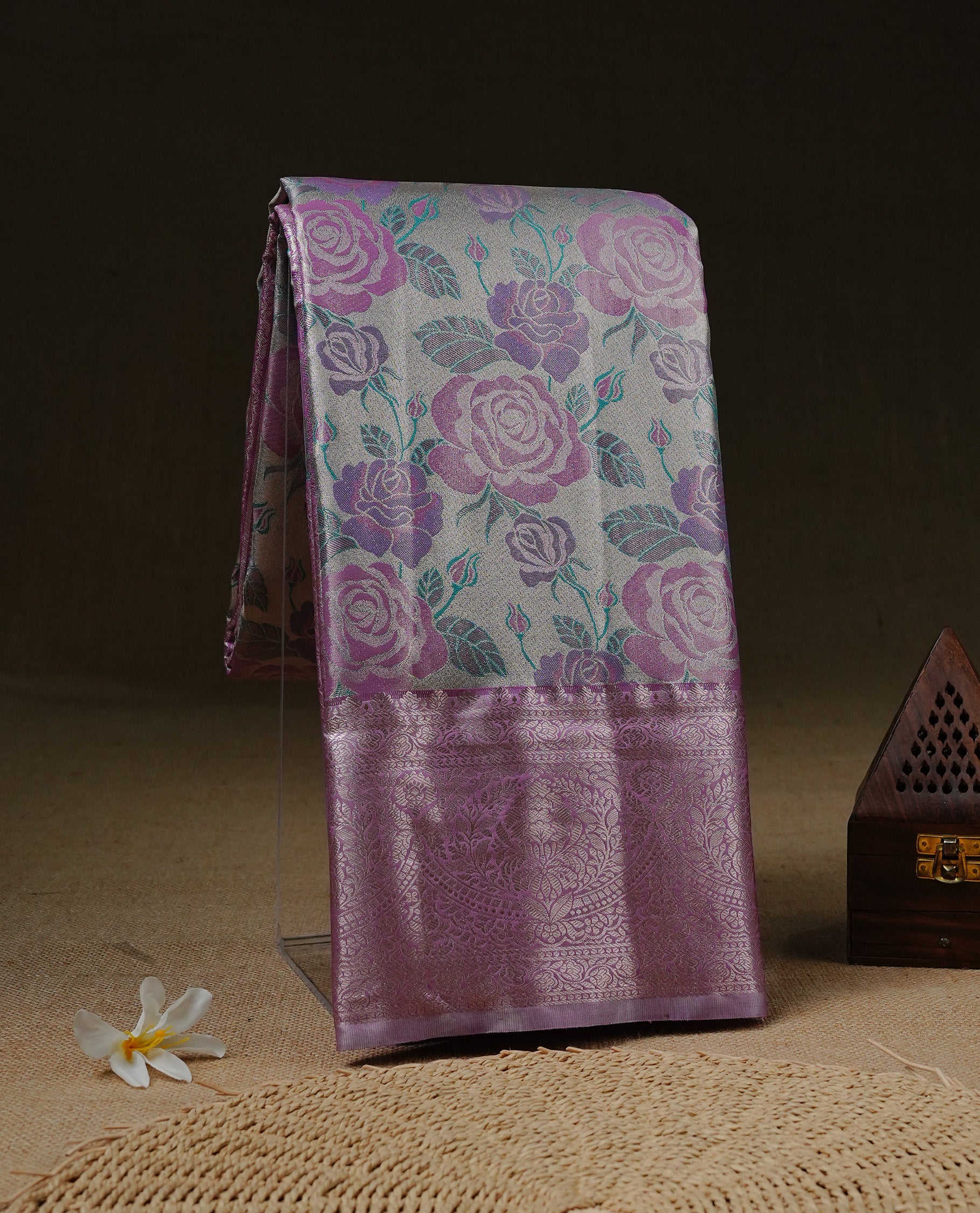 Light Gold Tissue silk saree featuring Pink colour floral design on body, complemented by Pink colour with Light gold zari border, paired with matching blouse piece.