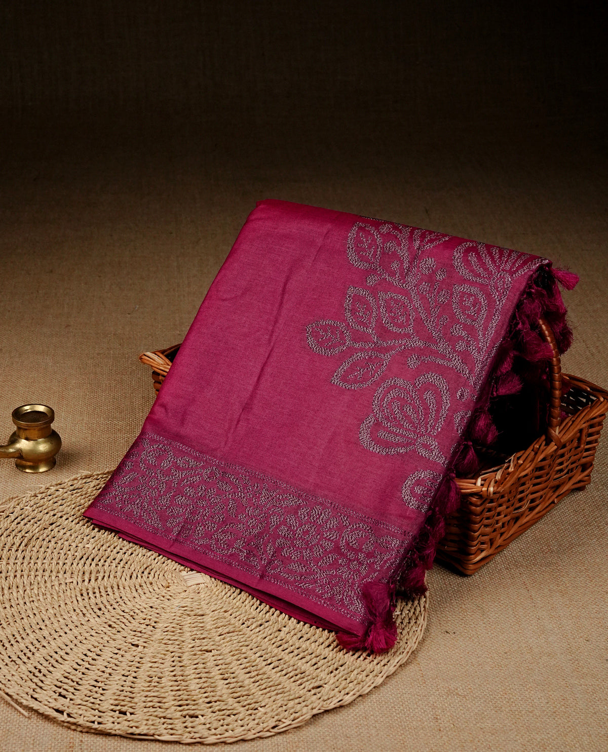 Maroon colour banaras saree featuring Antique zari kodi pattern on body, complemented by Zari pattern on self colour border, comes with matching blouse piece.