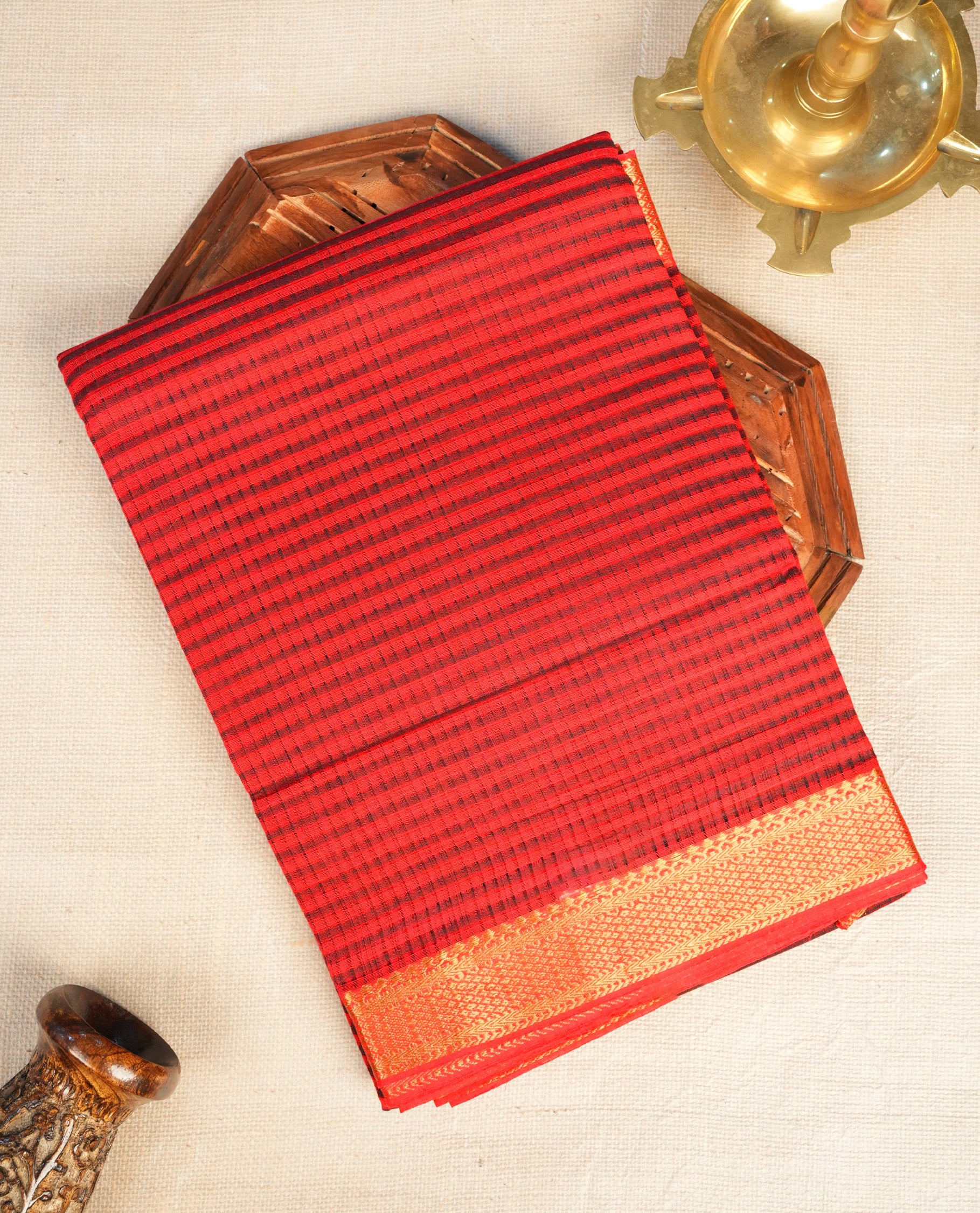 Red Mangalagiri cotton saree featuring elegant Black stripes On Body , a Two Inch Gold zari border & pallu, Paired With a matching blouse piece.