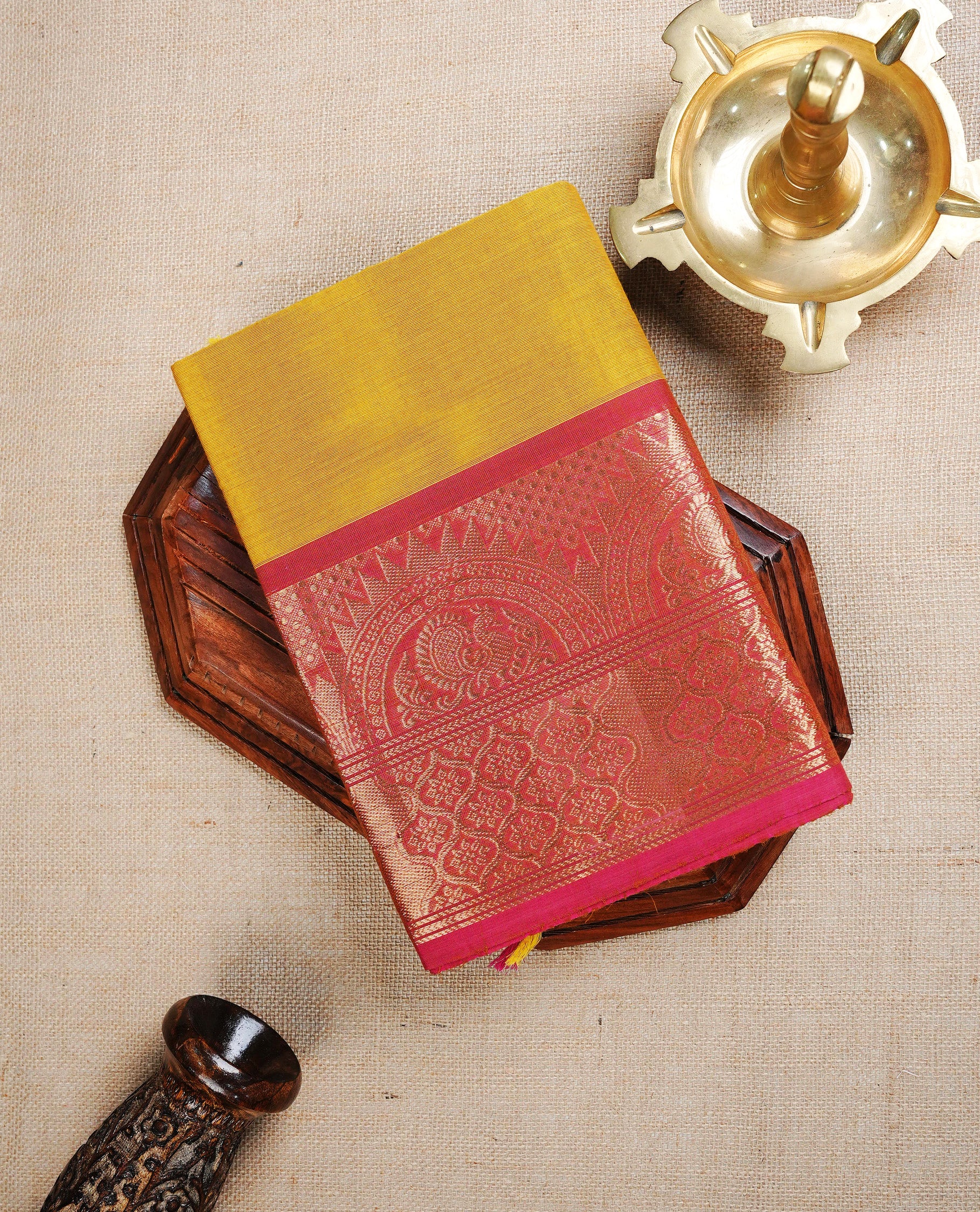 Dark Yellow colour chettinad cotton saree featuring Plain body, complemented by Contrast Brick Red Colour With Gold Zari border, paired with matching blouse piece.